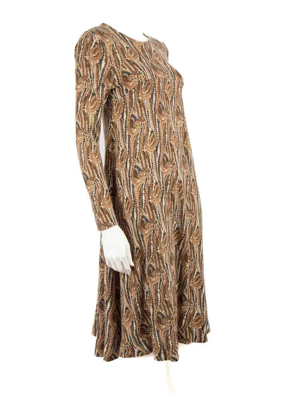 CONDITION is Very good. Hardly any visible wear to dress is evident on this used Diane Von Furstenberg designer resale item.
 
 Details
 Vintage 70's
 Brown
 Synthetic
 Midi dress
 Marbled pattern
 Round neckline
 Long sleeves
 Stretchy
 Back zip