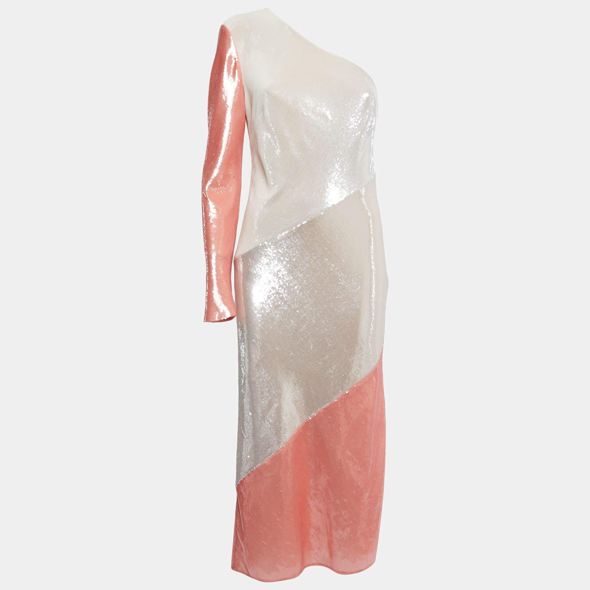 The Diane Von Furstenberg midi dress is a stunning piece that exudes elegance and glamour. The dress features intricate sequin detailing in a beautiful white and pink color palette, creating a mesmerizing visual effect. With its one-shoulder design