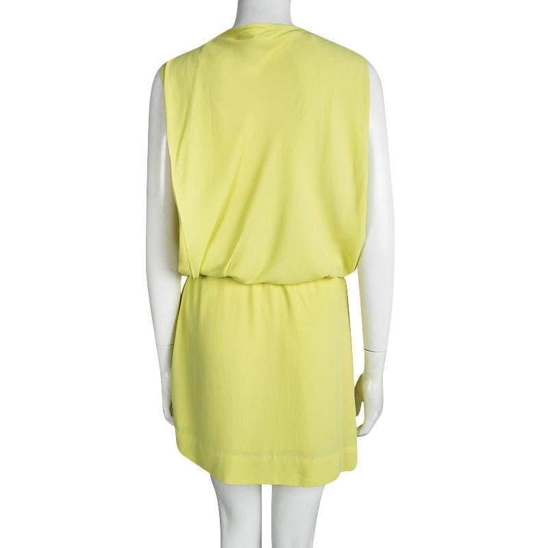 The eponymous label Diane Von Furstenberg brings to you this lovely drop-waist Gagon dress for all your summer outings. The yellow sleeveless dress is made of a viscose and rayon blend and has an asymmetrical silhouette. It features a V-neckline