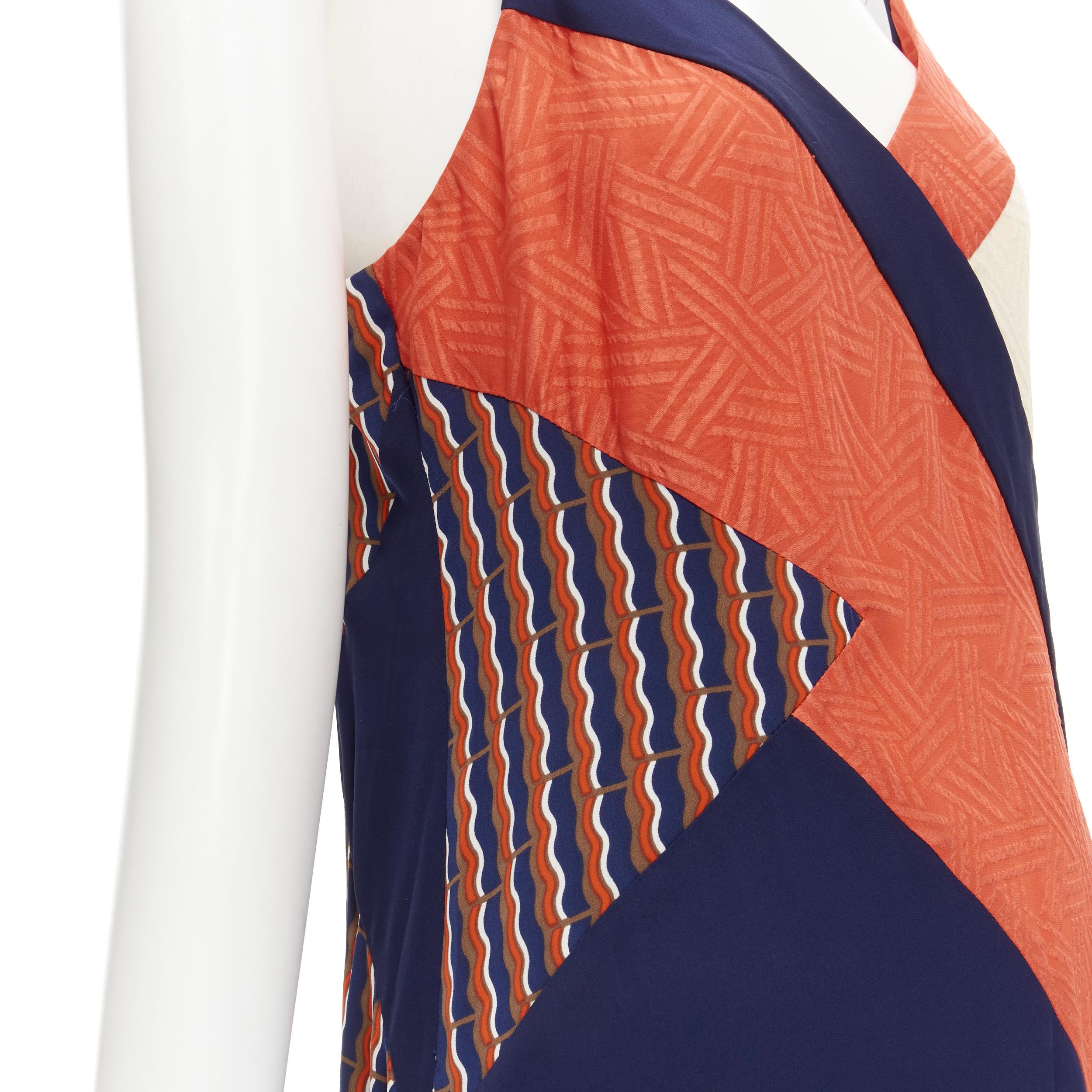 DIANE VON FURSTENBURG orange blue geometric colorblocked summer silk dress US8 M 
Reference: CECU/A00006 
Brand: Diane Von Furstenburg 
Material: Silk 
Color: Orange 
Pattern: Geometric 
Extra Detail: Side slit. 
Made in: China 

CONDITION: