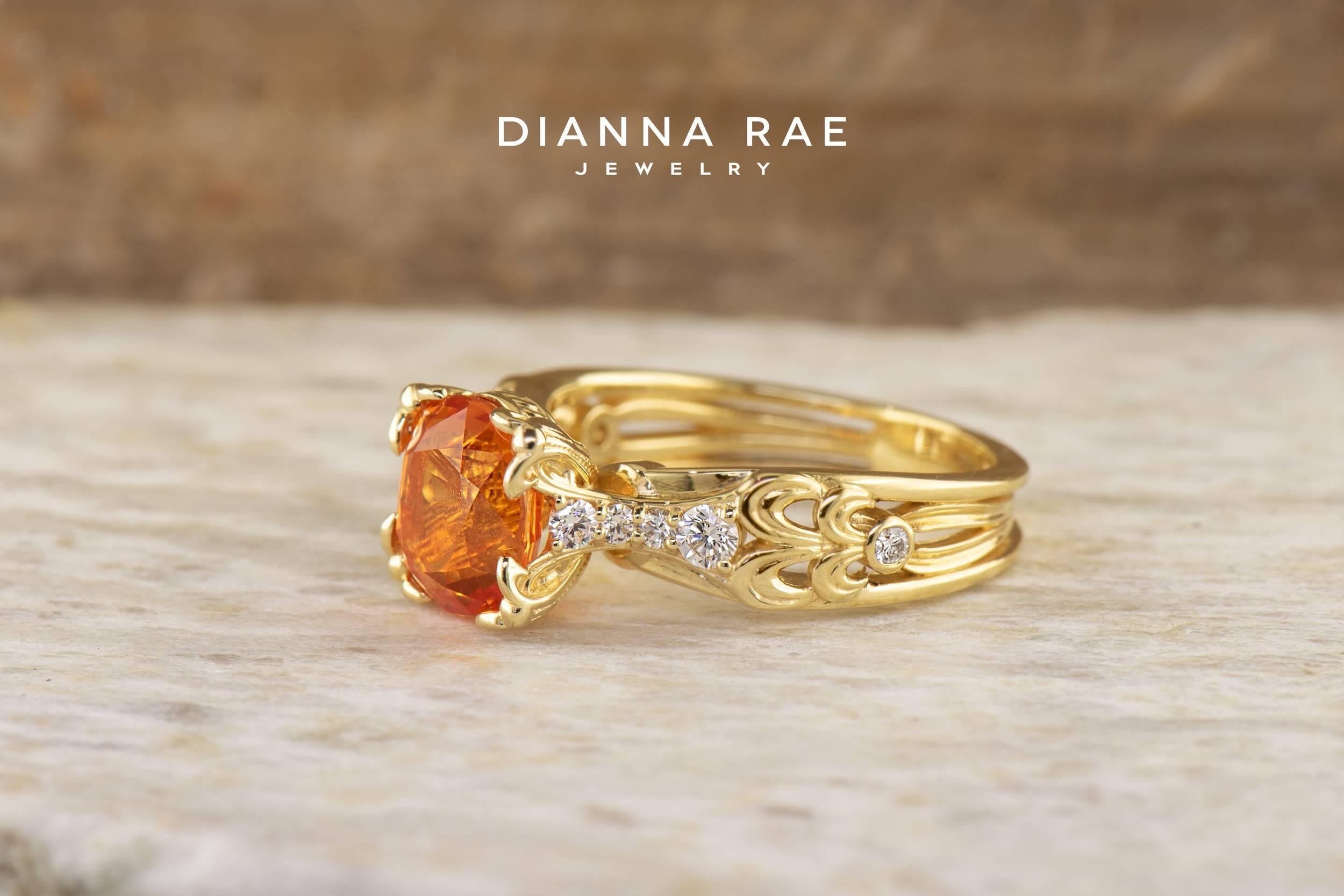 This floral and vintage inspired 18k Yellow Gold Ring features a vivid oval Orange Sapphire with diamond accents.  

Set with a 3.16 carat genuine orange sapphire and 10=0.20Tw Round G Si1 Diamonds.