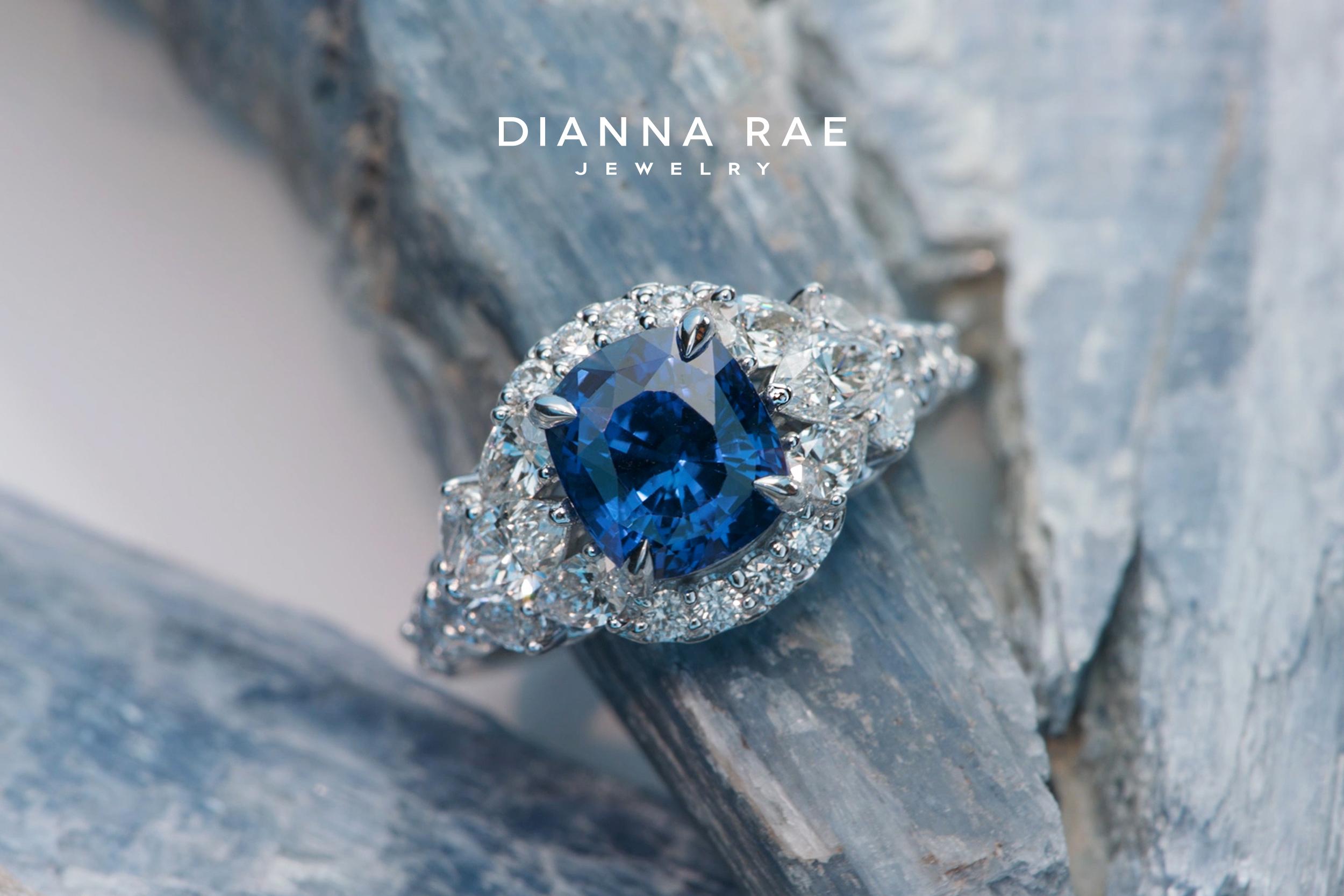 An awe-inspiring Dianna Rae Original design, the ‘Infinite Glacier’—this Sri Lankan Sapphire and Ideal Cut Diamond cocktail ring was inspired to mimic a cascade-like glacier of white ice on either side of the center gemstone. Beautifully crafted in