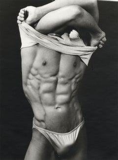 Anthony (vintage silver gelatin photo of a male stripping, showing chiseled abs)