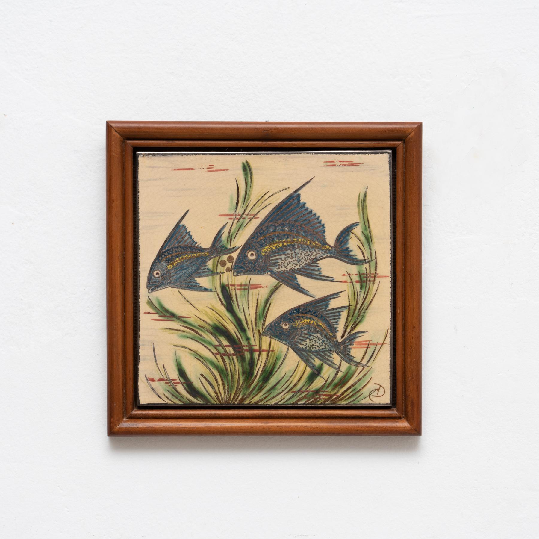 Ceramic hand painted artwork of a fish by Catalan artist Diaz Costa, circa 1960.  Framed. Signed.    In original condition, with minor wear consistent of age and use, preserving a beautiul patina.
