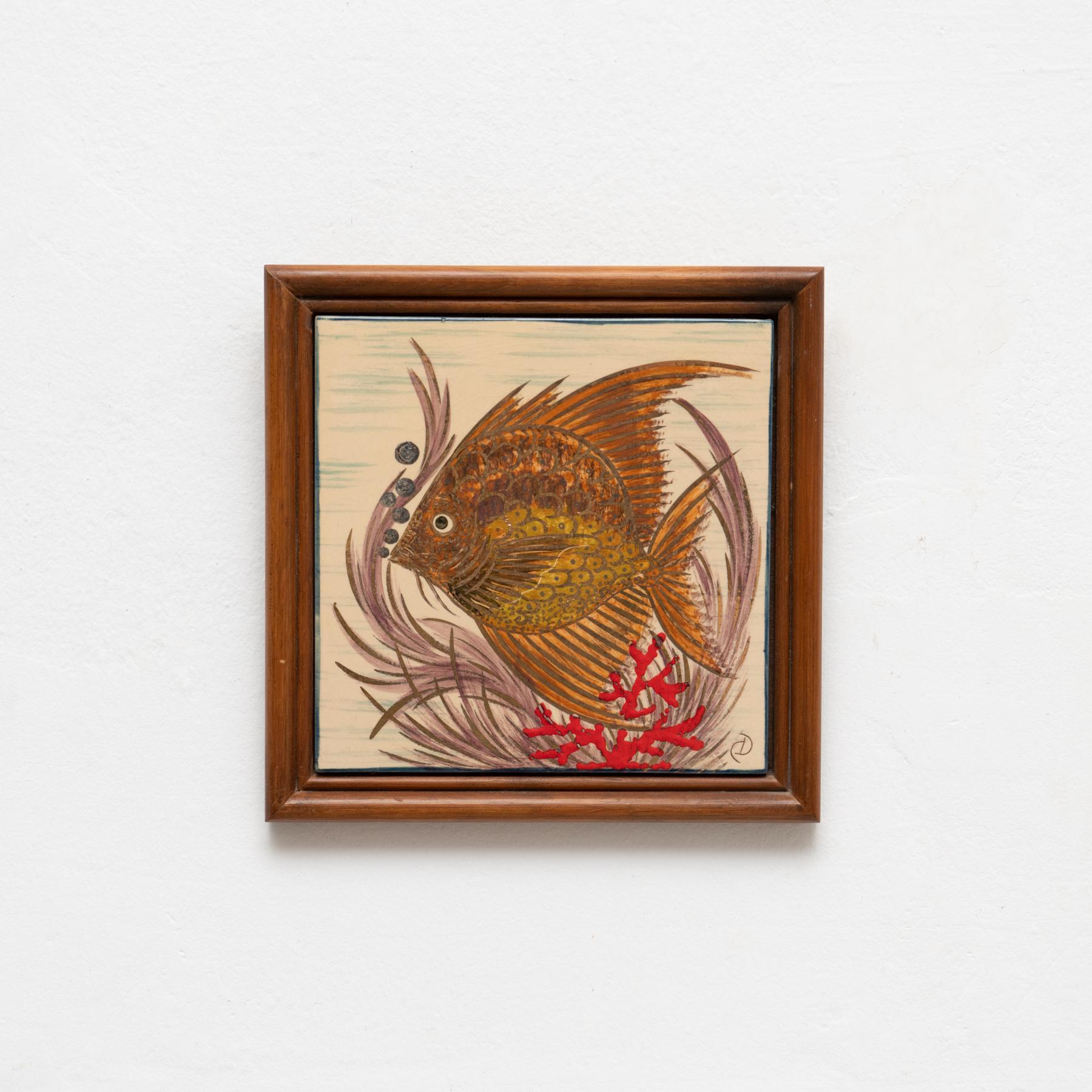 Ceramic hand painted artwork of a fish by Catalan artist Diaz Costa, circa 1960.  Framed. Signed.    In original condition, with minor wear consistent of age and use, preserving a beautiul patina.