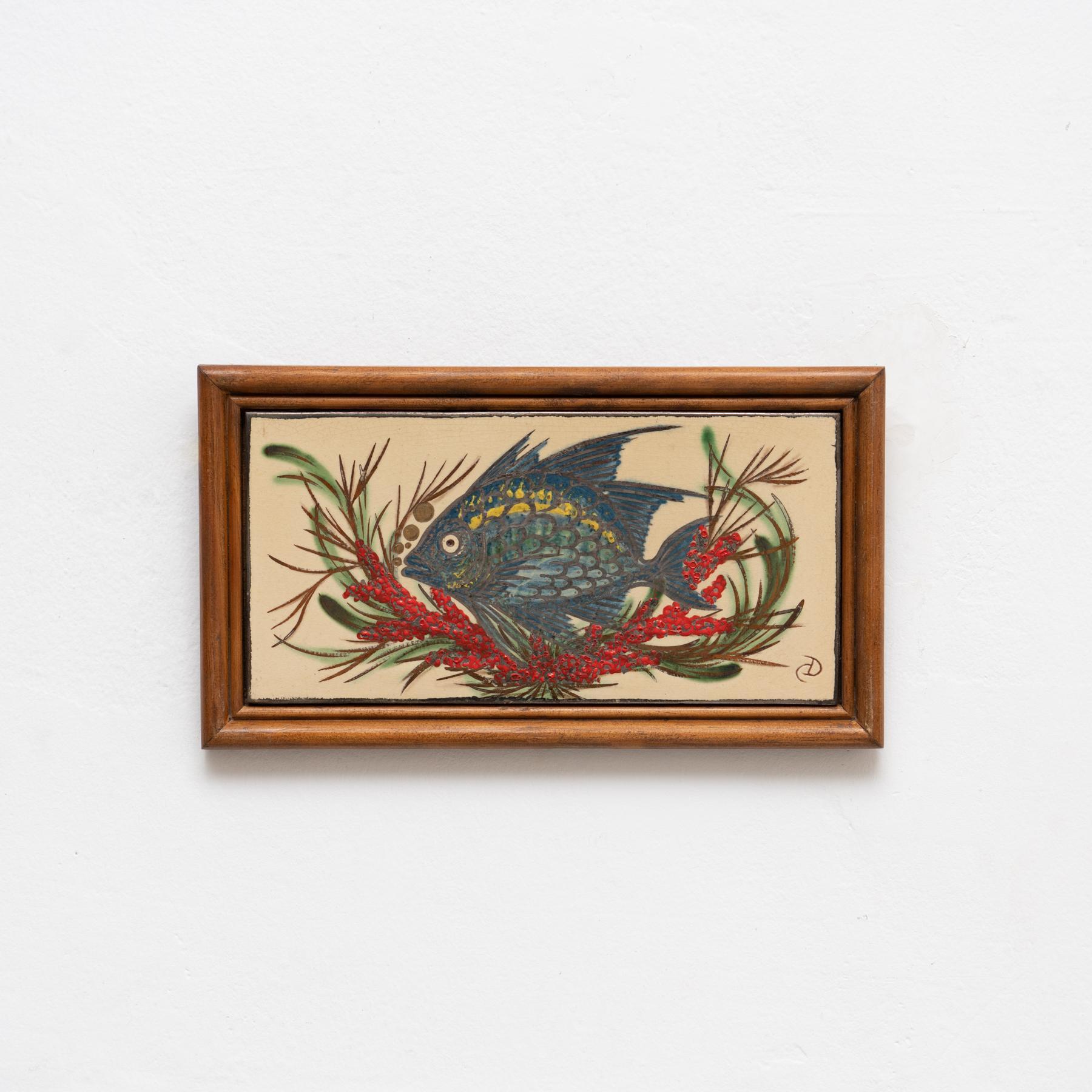 Ceramic hand painted artwork of a fish by Catalan artist Diaz Costa, circa 1960.  Framed. Signed.    In original condition, with minor wear consistent of age and use, preserving a beautiul patina.