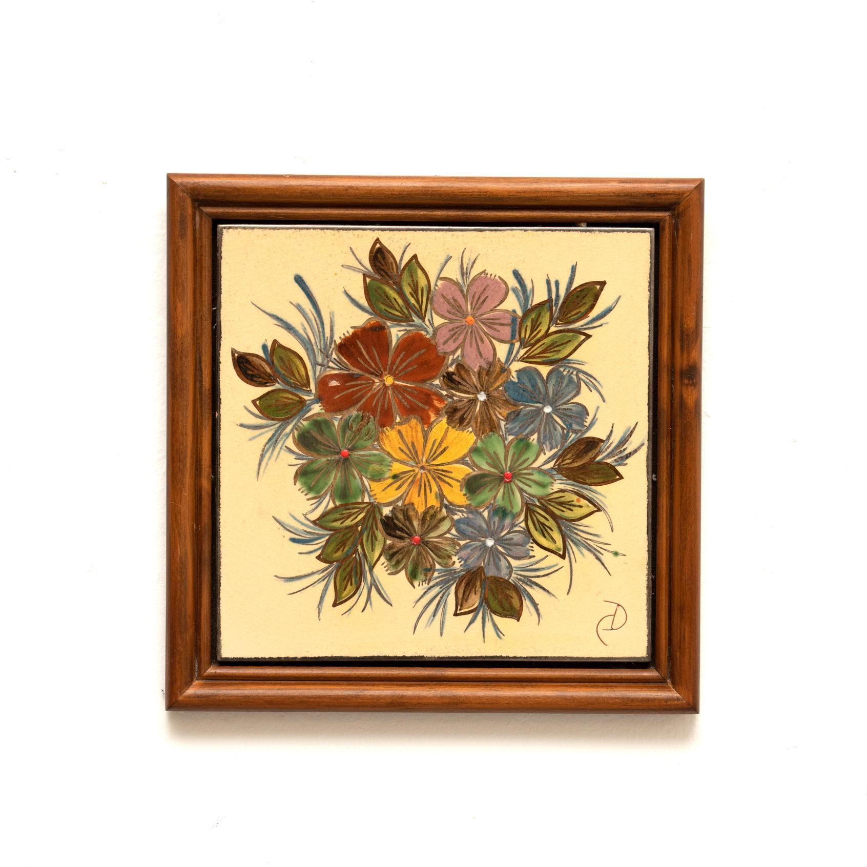 Ceramic hand painted artwork of a floral design by Catalan artist Diaz Costa, circa 1960.  Framed. Signed.    In original condition, with minor wear consistent of age and use, preserving a beautiul patina.