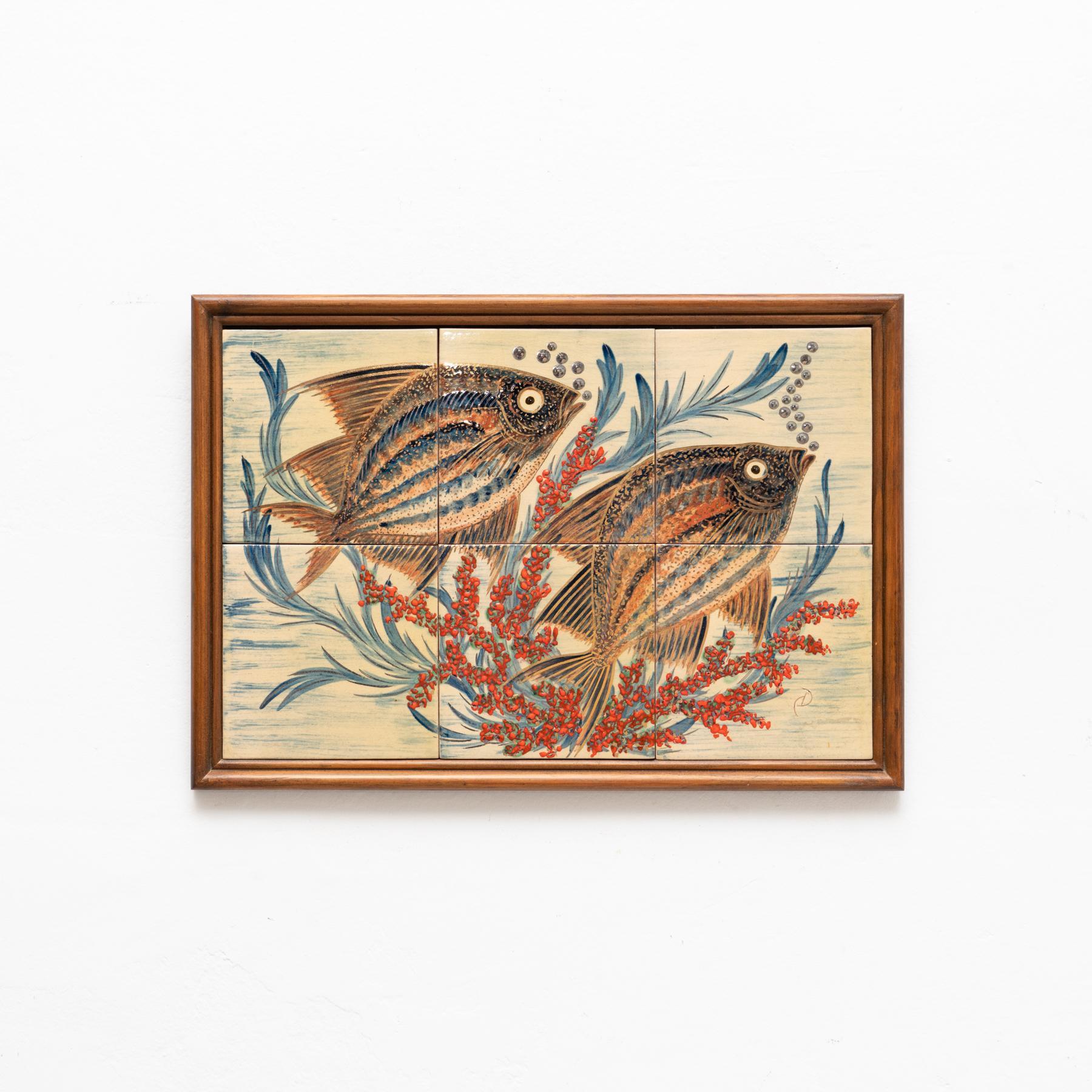 Ceramic hand painted artwork of two fishes by Catalan artist Diaz Costa, circa 1960.  Framed. Signed.    In original condition, with minor wear consistent of age and use, preserving a beautiul patina.
