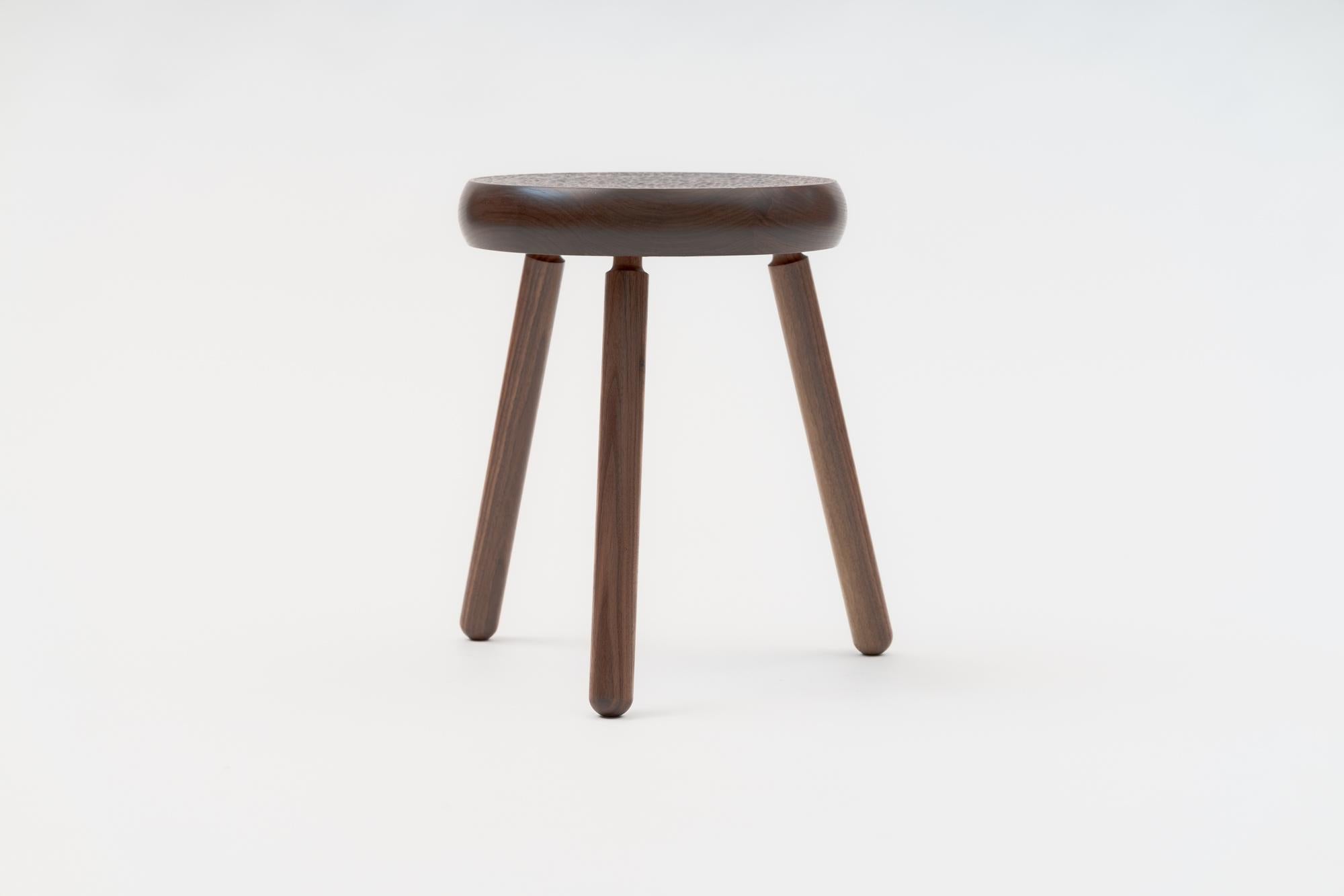 A versatile piece of furniture, the Dibbet Stool functions as an extra seat, ottoman, or side table. Reminiscent of Shaker or early frontier furniture, the thick seat is hand carved with a slight concave that leaves a tactile and smooth texture. The
