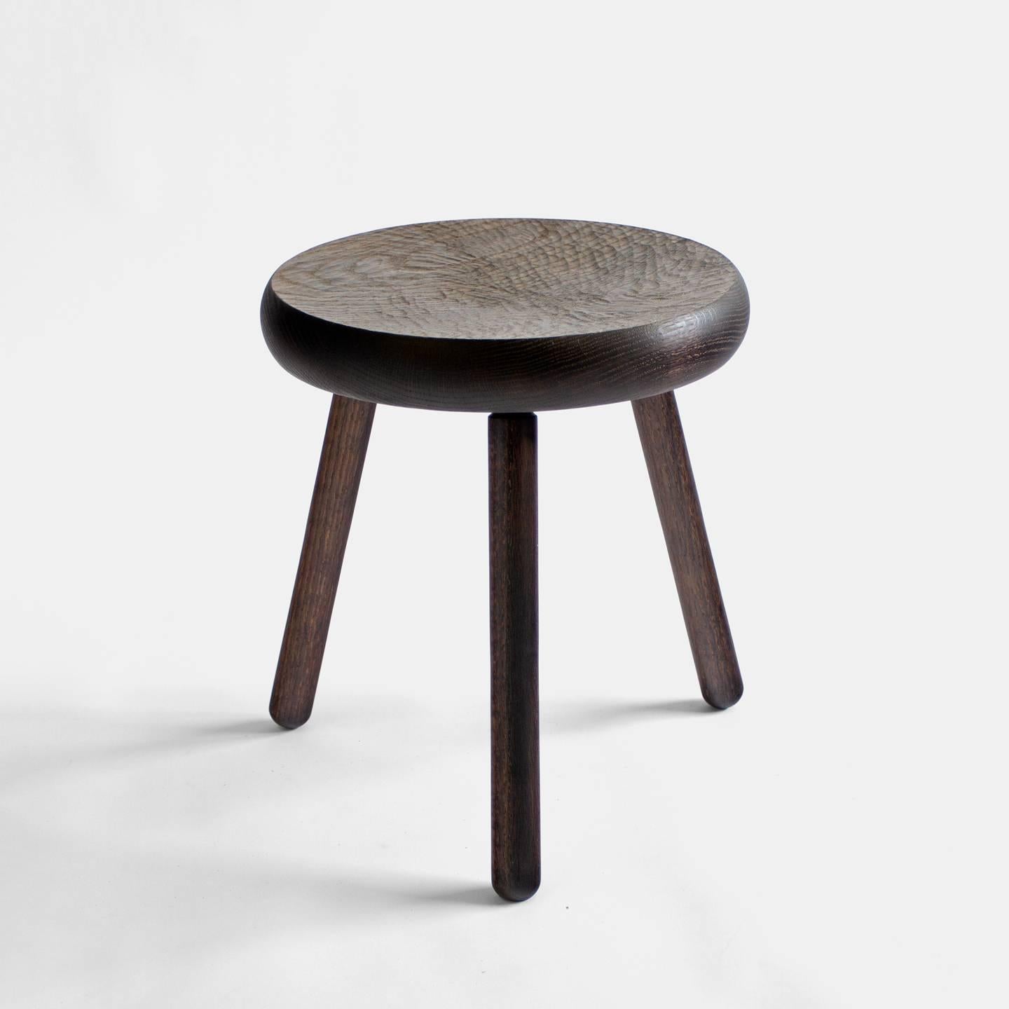 A versatile piece of furniture, the Dibbet stool functions as seating, an ottoman, or a side table. Reminiscent of shaker or early frontier furniture. The thick seat is hand-carved with a slight concave that leaves a tactile and smooth texture. The