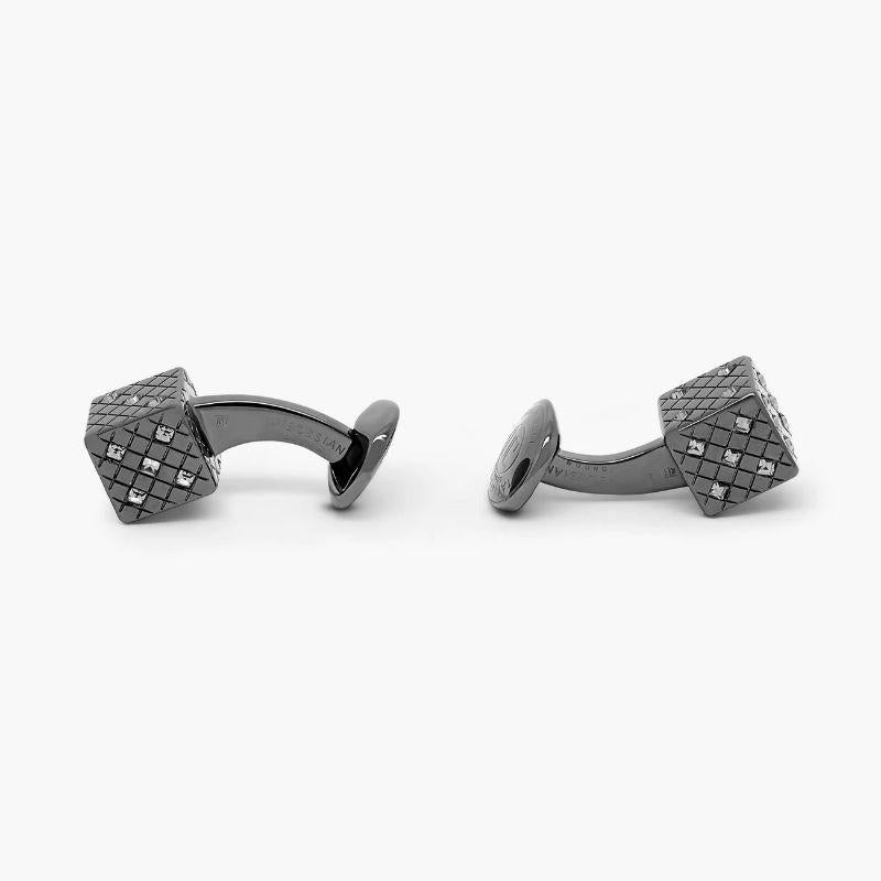 Dice cufflinks with black diamond Swarovski Elements

Sparkling white diamond-coloured Swarovski elements are arranged to form the numbers of dice within an intricately engraved diamond pattern frame. Set in black rhodium plated base metal, our