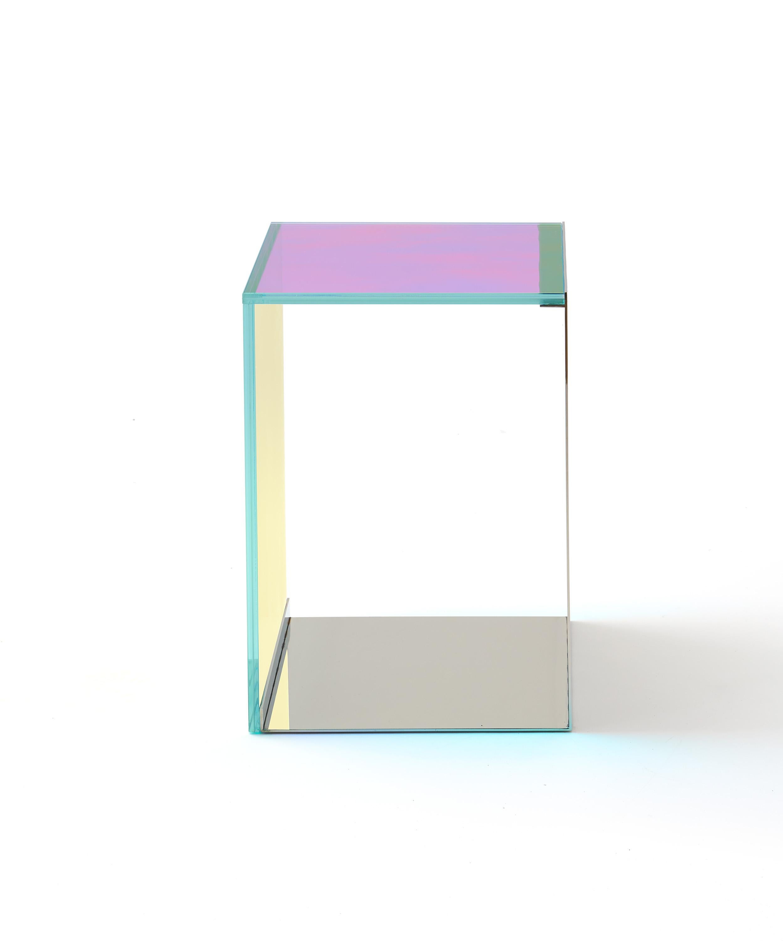 Item No: TA-004

The award-winning Dichroic table is an active statement piece that evolved from Lauren's fascination with early Light and Space artists. As natural light changes throughout the day, the surfaces of the table dramatically shift