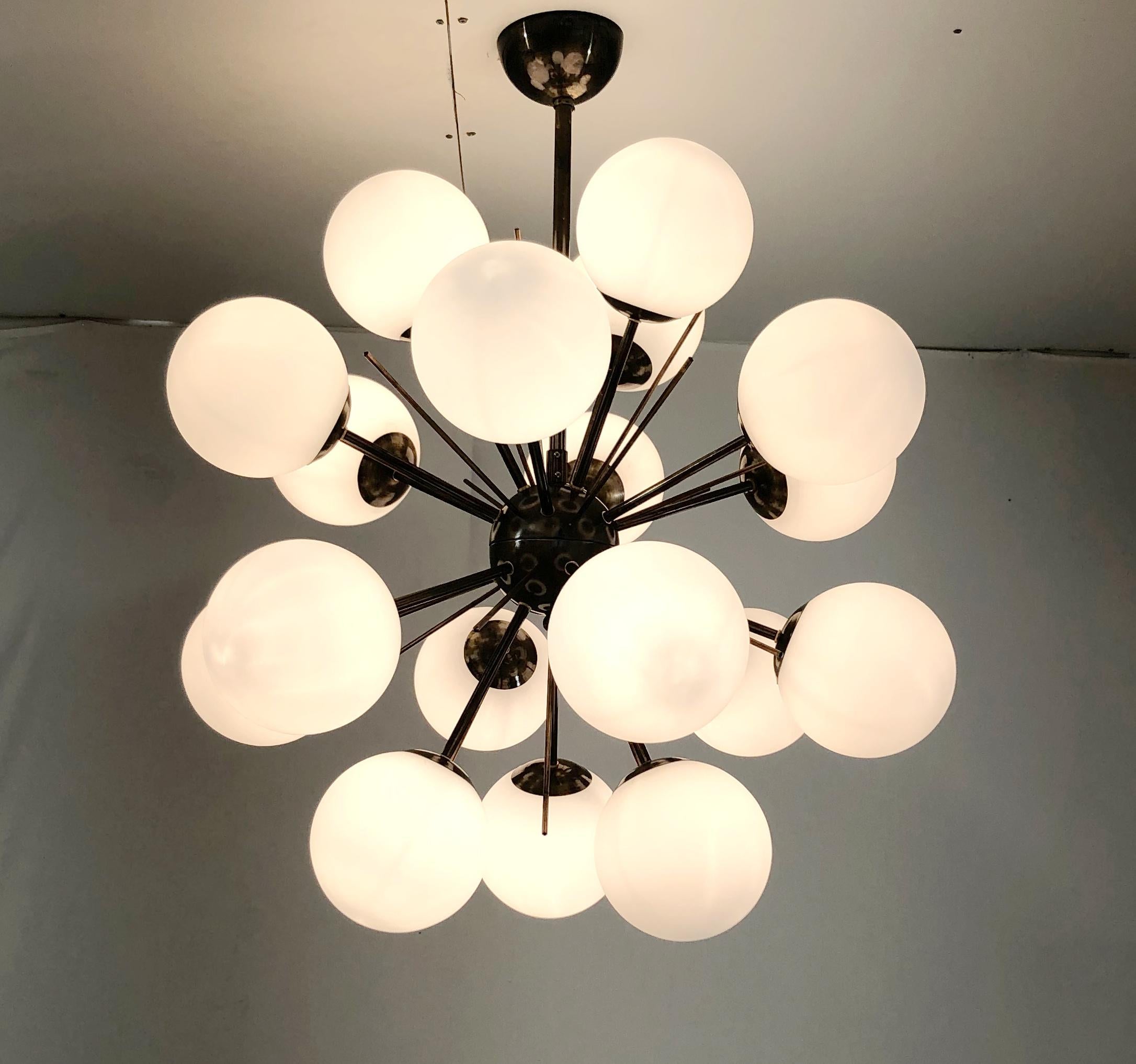 Italian sputnik chandelier with 18 Murano glass globes mounted on brass frame / Designed by Fabio Bergomi for Fabio Ltd / Made in Italy
18 lights / E12 or E14 type / max 40W each
Diameter: 29 inches / Height: 32 inches including rod and canopy
Order