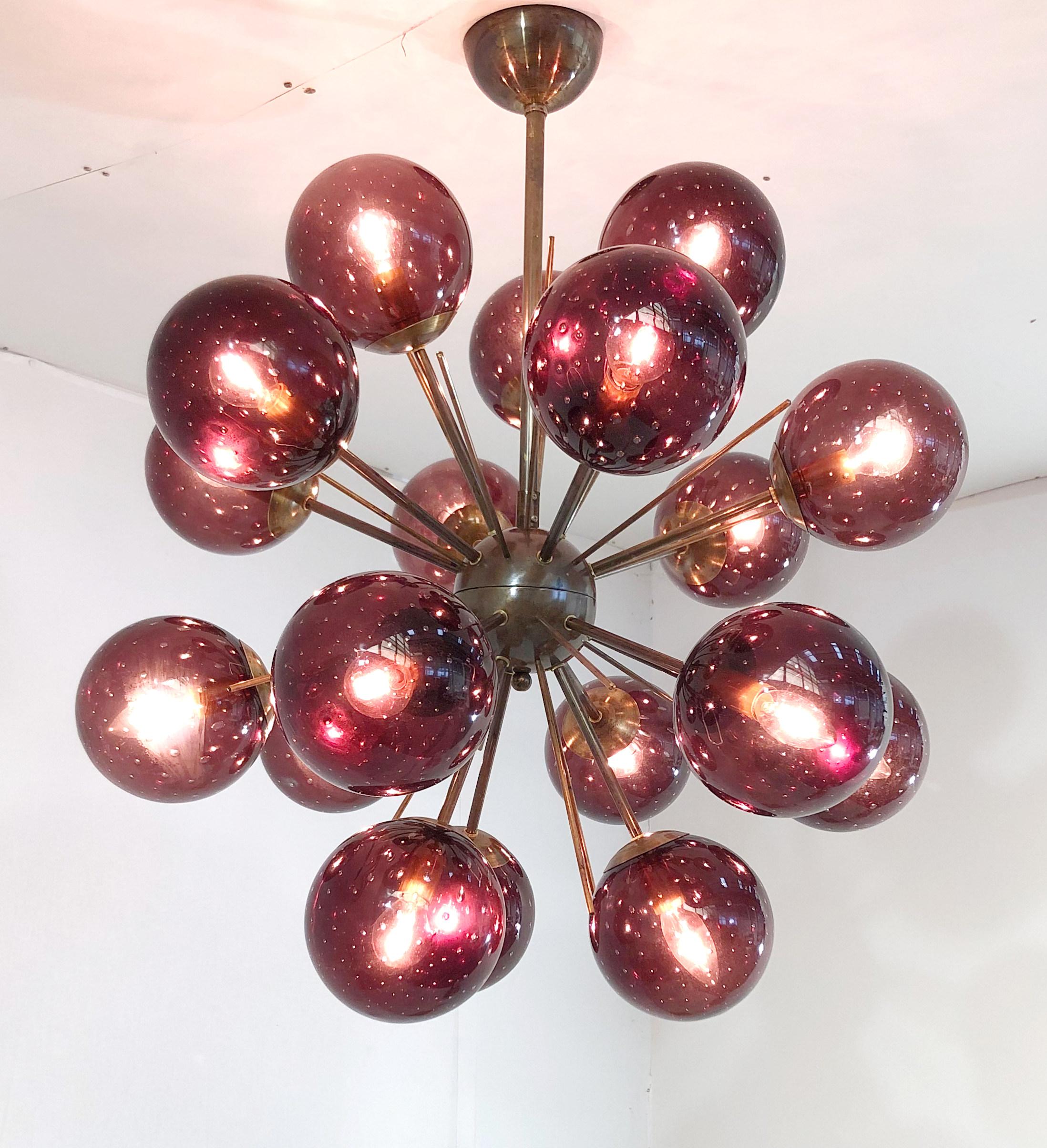 Italian sputnik chandelier with 18 Murano glass globes mounted on brass frame / Designed by Fabio Bergomi for Fabio Ltd / Made in Italy
18 lights / E12 or E14 type / max 40W each
Diameter: 29 inches / Height: 32 inches including rod and canopy
Order