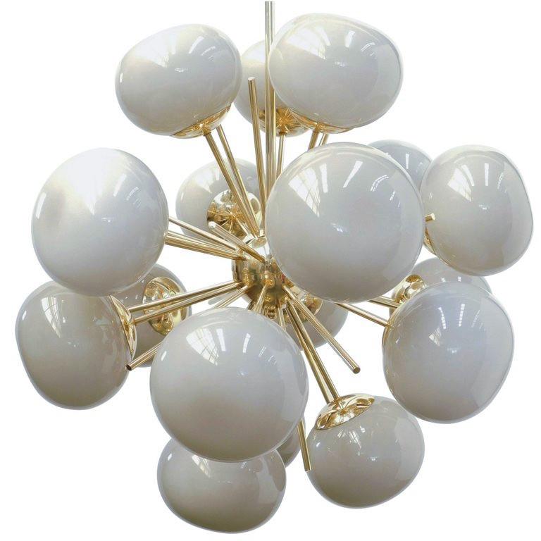 Italian sputnik chandelier with 18 gray Murano pebble glass shades mounted on brass frame / Designed by Fabio Bergomi for Fabio Ltd / Made in Italy
18 lights / E12 or E14 type / max 40W each
Diameter: 29 inches / Height: 32 inches including rod and