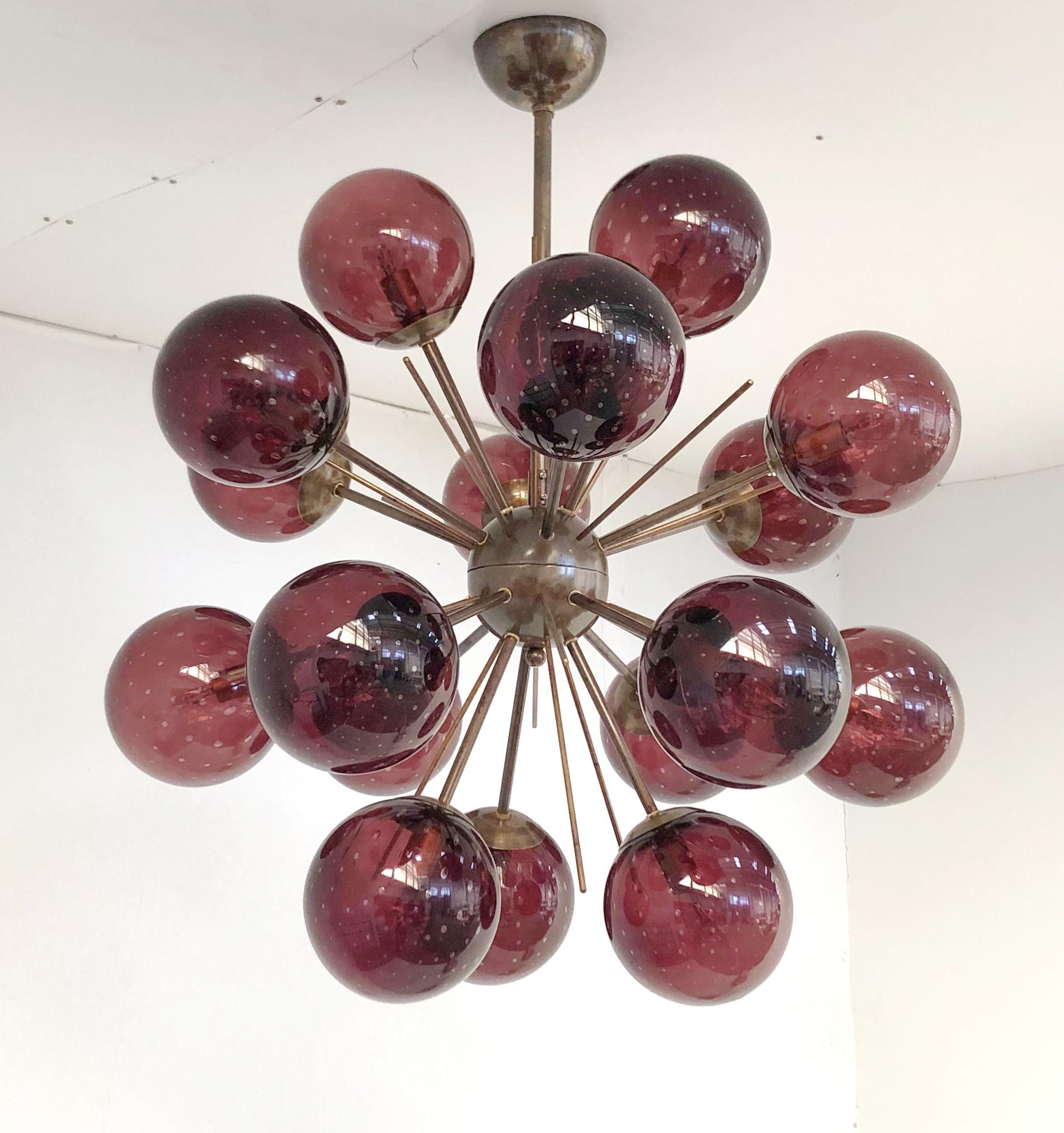 Italian sputnik chandelier with 18 murano glass globes mounted on brass frame / Designed by Fabio Bergomi for Fabio Ltd / Made in Italy
18 lights / E12 or E14 type / max 40W each
Measures: diameter: 29 inches / height: 32 inches including rod and