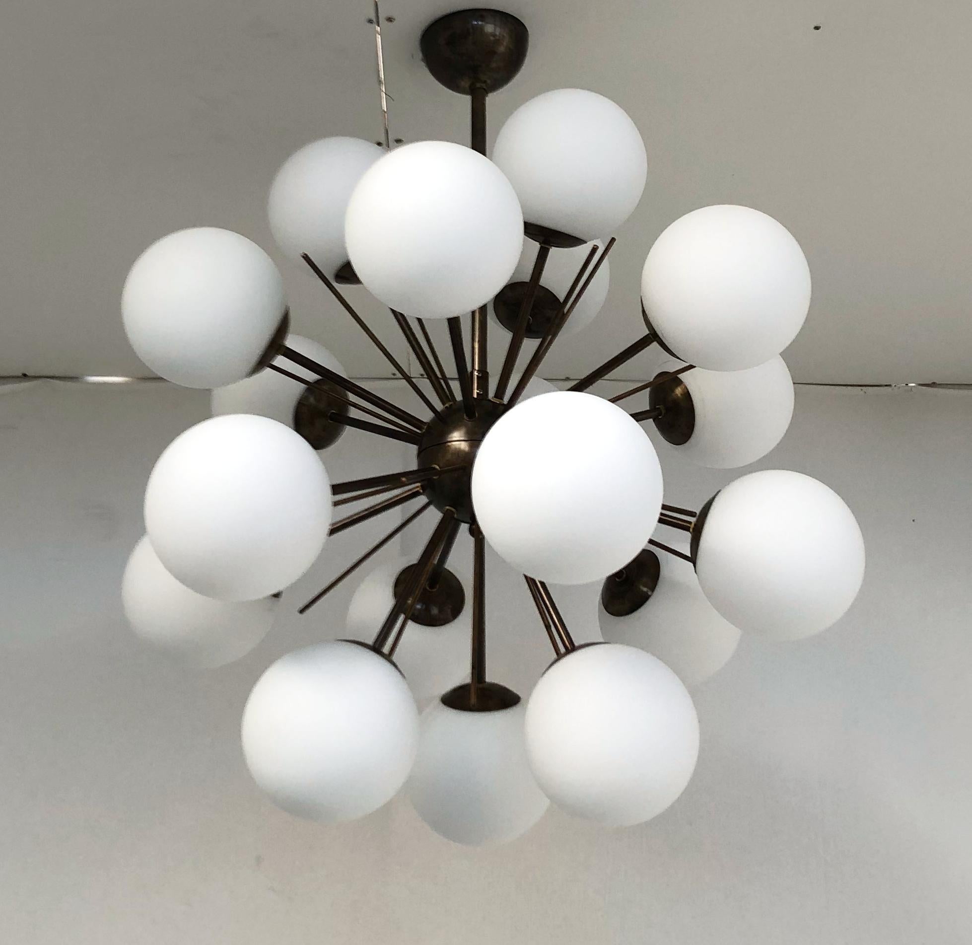 Italian sputnik chandelier with 18 Murano glass globes mounted on brass frame / Designed by Fabio Bergomi for Fabio Ltd / Made in Italy
18 lights / E12 or E14 type / max 40W each
Measures: Diameter: 29 inches / Height: 32 inches including rod and