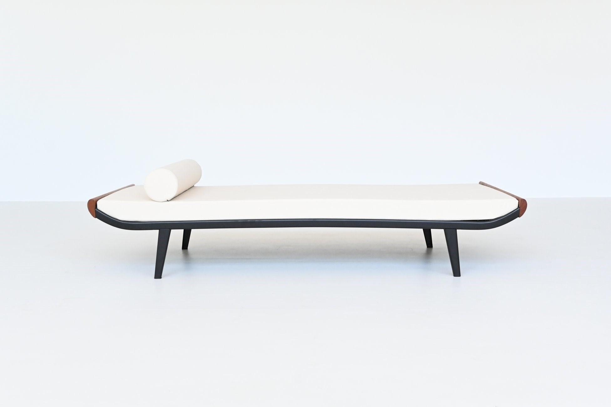 Beautiful and iconic Cleopatra daybed designed by Dick Cordemeijer for Auping, The Netherlands 1954. The frame is made of black coated metal and the ends are in solid teak wood. The mattress is upholstered with high quality off-white linen fabric,