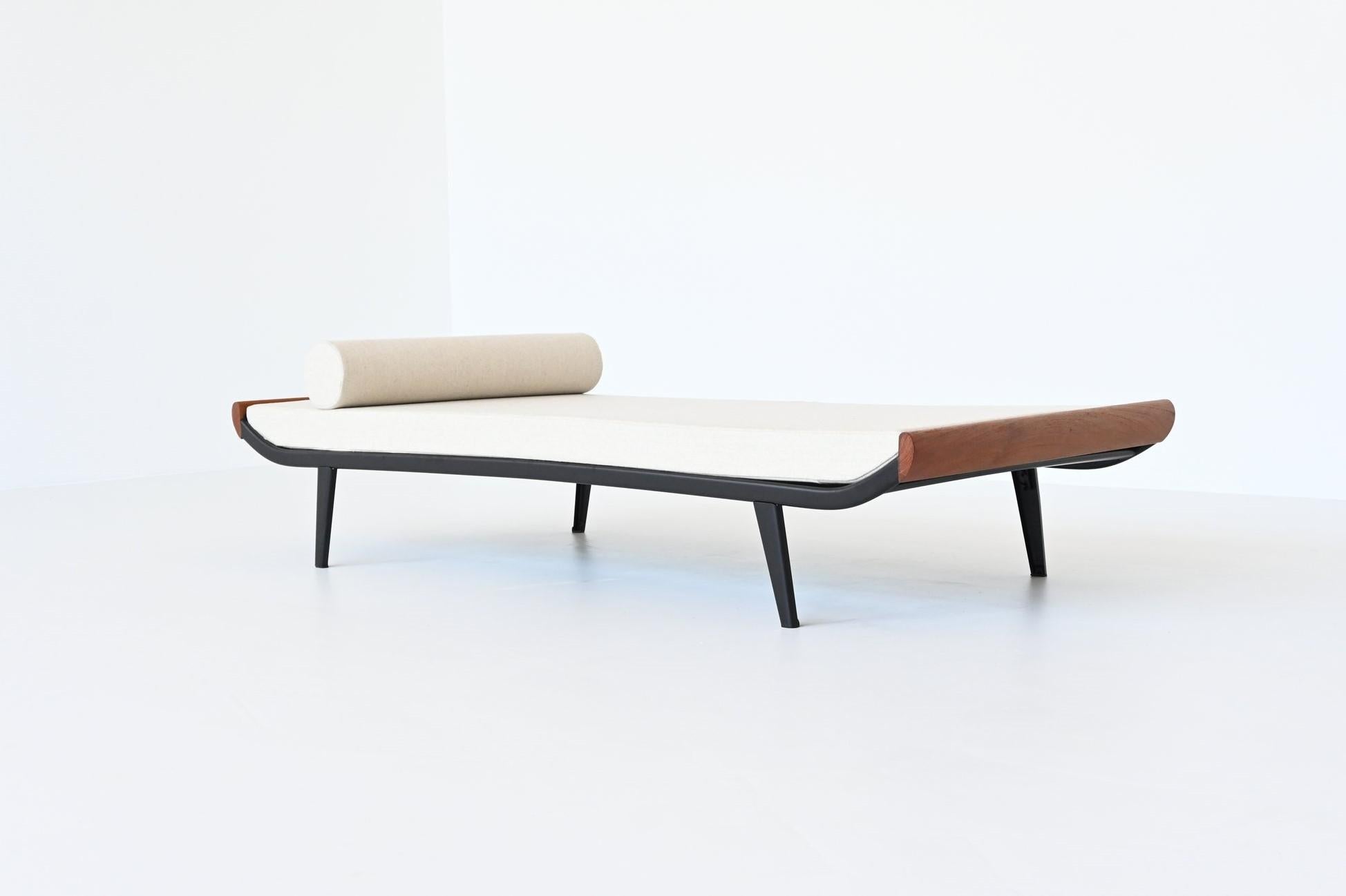 Beautiful and iconic Cleopatra daybed designed by Dick Cordemeijer for Auping, The Netherlands 1954. The frame is made of black coated metal and the ends are in solid teak wood. The mattress is upholstered with high quality off-white wool fabric,