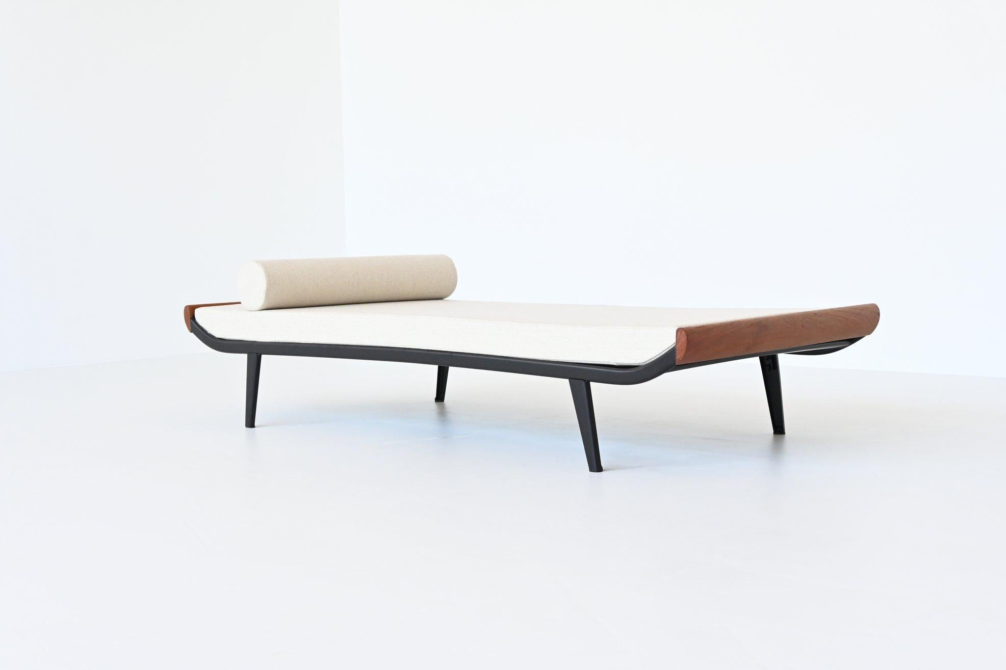 Beautiful and iconic Cleopatra daybed designed by Dick Cordemeijer for Auping, The Netherlands 1954. The frame is made of black coated metal and the ends are in solid teak wood. The mattress is upholstered with high quality off-white wool fabric,