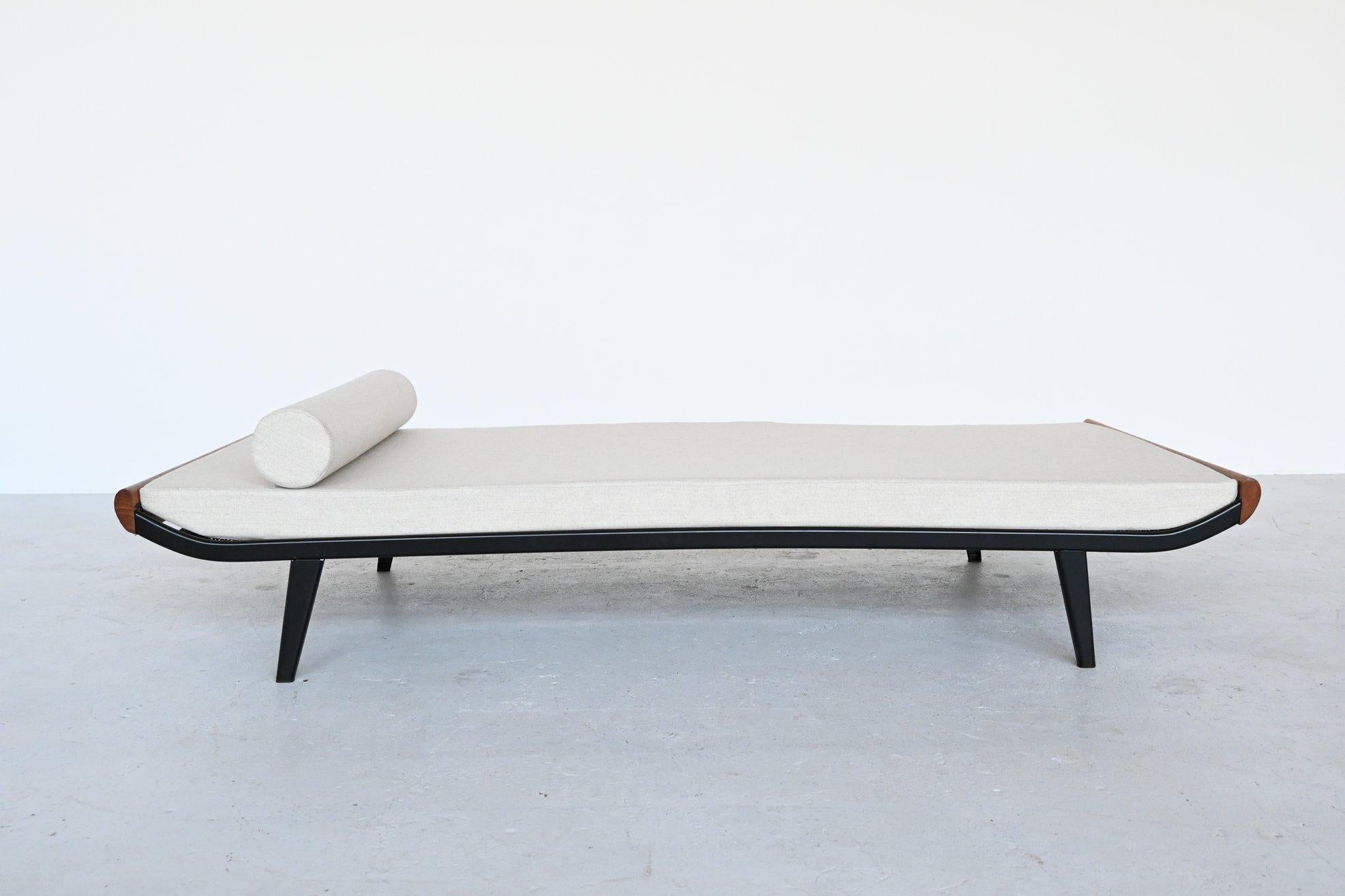 Beautiful and iconic Cleopatra daybed designed by Dick Cordemeijer for Auping, The Netherlands 1954. Typical industrial Dutch design. The frame is made of black coated metal and the ends are in solid teak wood. This mattress is upholstered with a