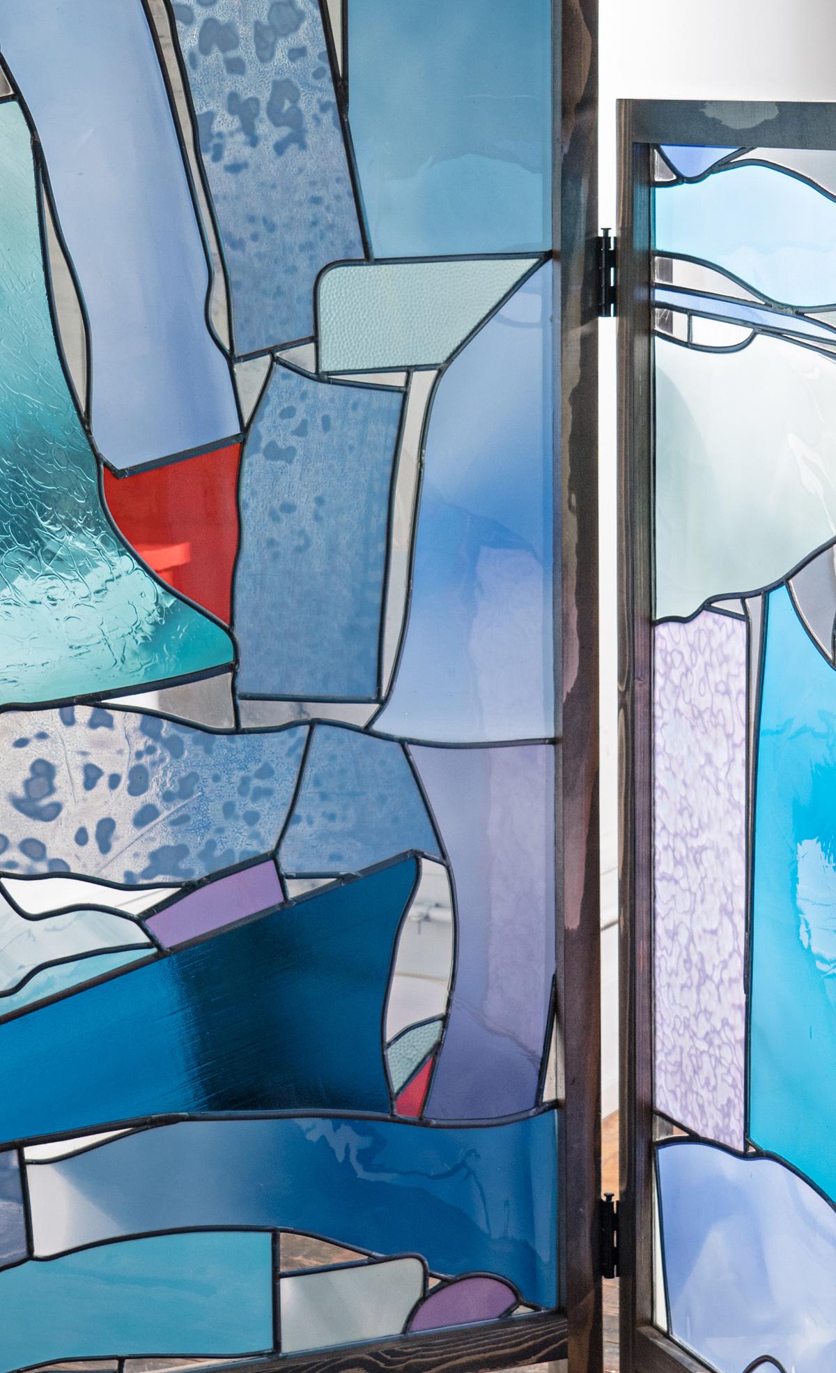 Known for his formal explorations of color, light, and abstraction in leaded glass, Weiss winds a lively color palette and joyful juxtapositions of forms into his work. His unique use of negative space and clear glass invites architectural and