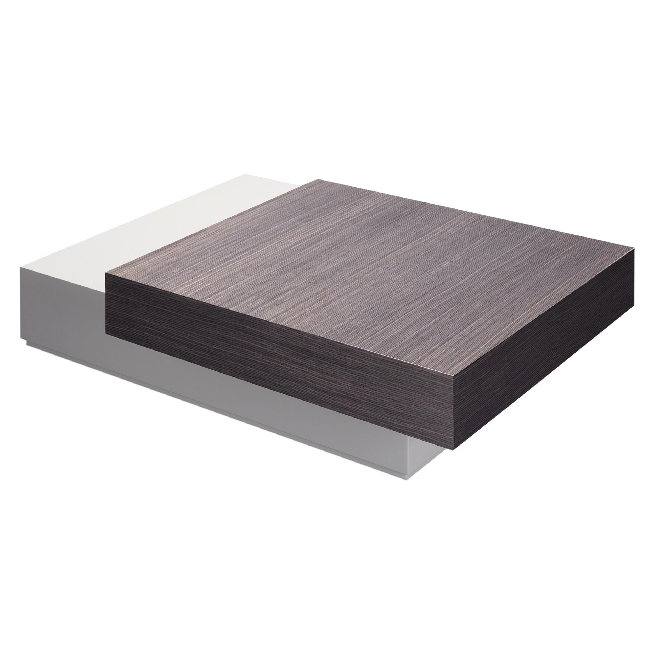 Dickens coffee table, with two overlapping drawers, is made of lacquered and veneered wood, but allows multiple combinations of finishes to suit any design needs.‎

Shown in glossy Grisio Gris top drawer, combined with glossy lacquered bottom drawer
