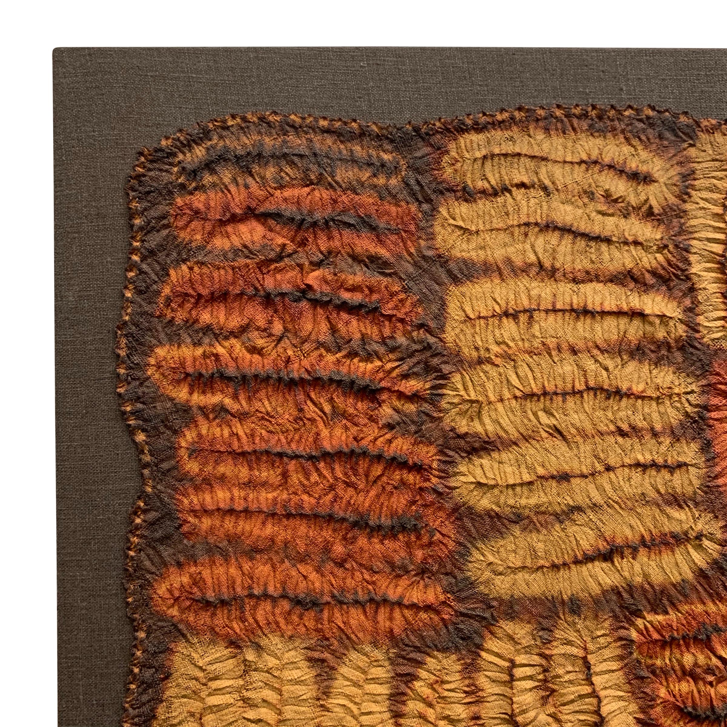 An incredible and rare mid-20th century Dida (Ivory Coast) hand-plated Shibori tie-dyed raffia ceremonial kerchief mounted on a linen stretched frame. This kerchief was not woven on a loom, but rather completely by hand creating a totally random