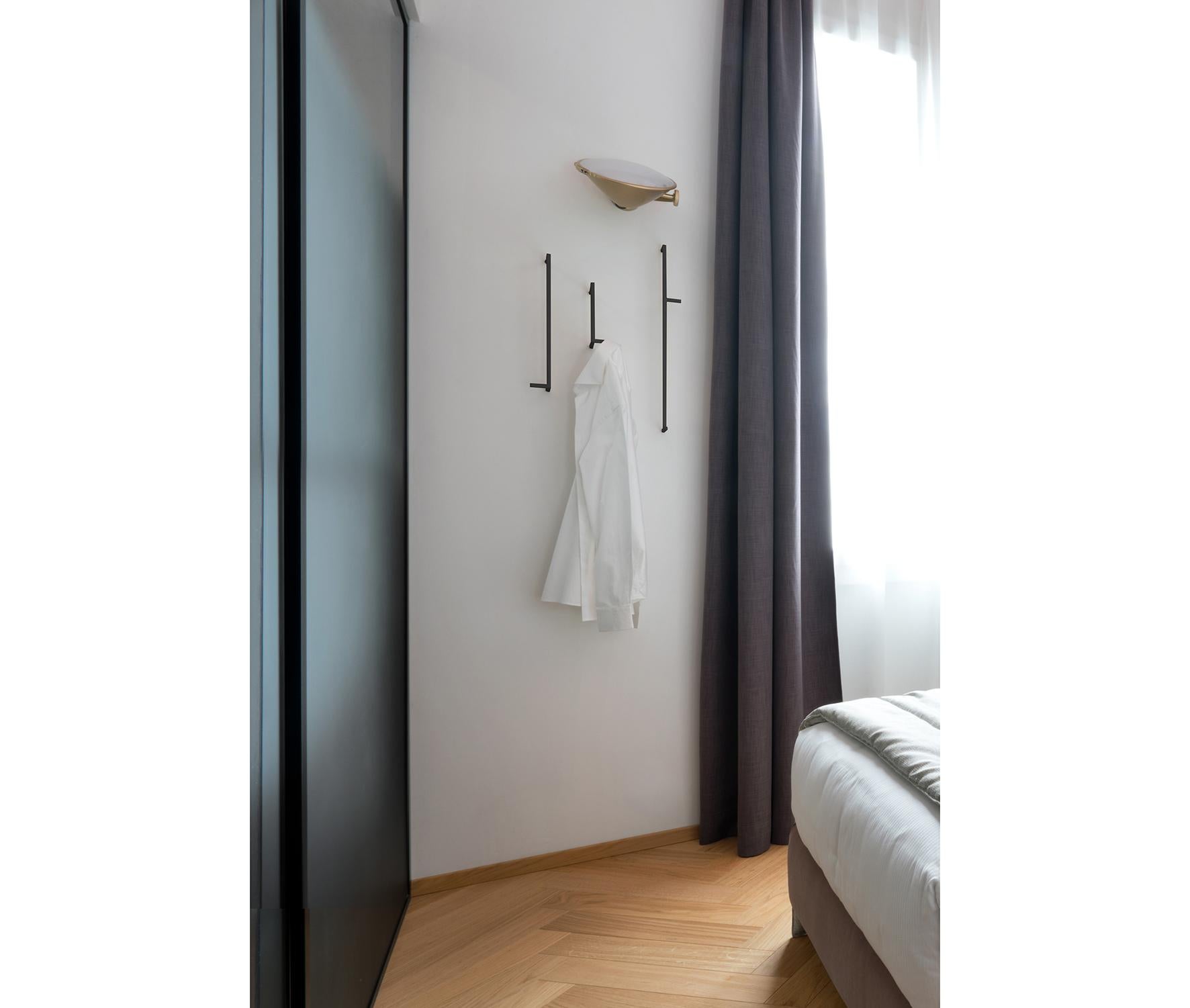 Dieci Dieci set of 3 hangers by Mentemano
Dimensions: 10 x 5 x 60 / 9 x 5 x 40 / 12,5 x 5 x 18 cm
Materials: Matt black brass

Mentemano is a design concept brand leading to a precise matter: is the “mente” (mind) leading the “mano” (hand) to