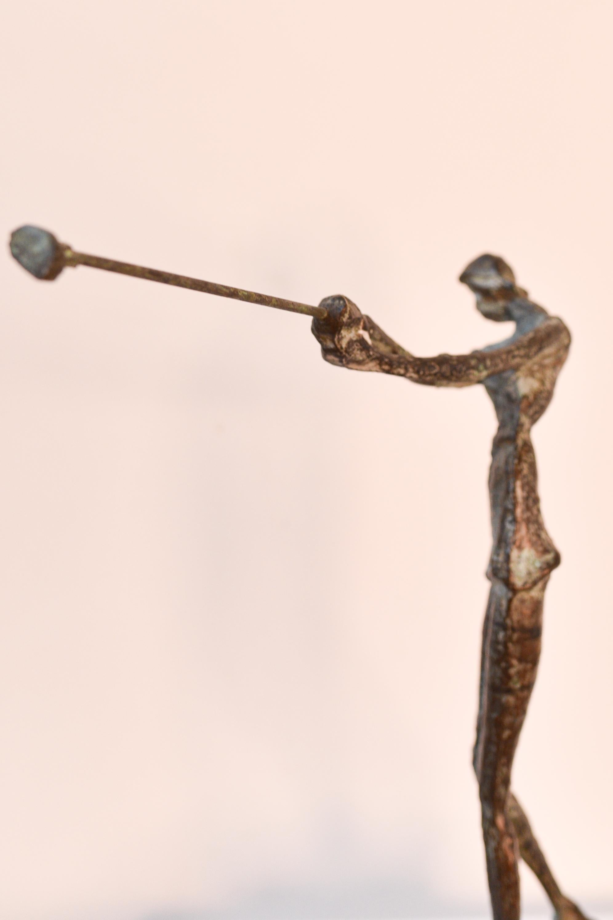 Bronze statue of a female golf player on a marble foot, after Giacometti 2