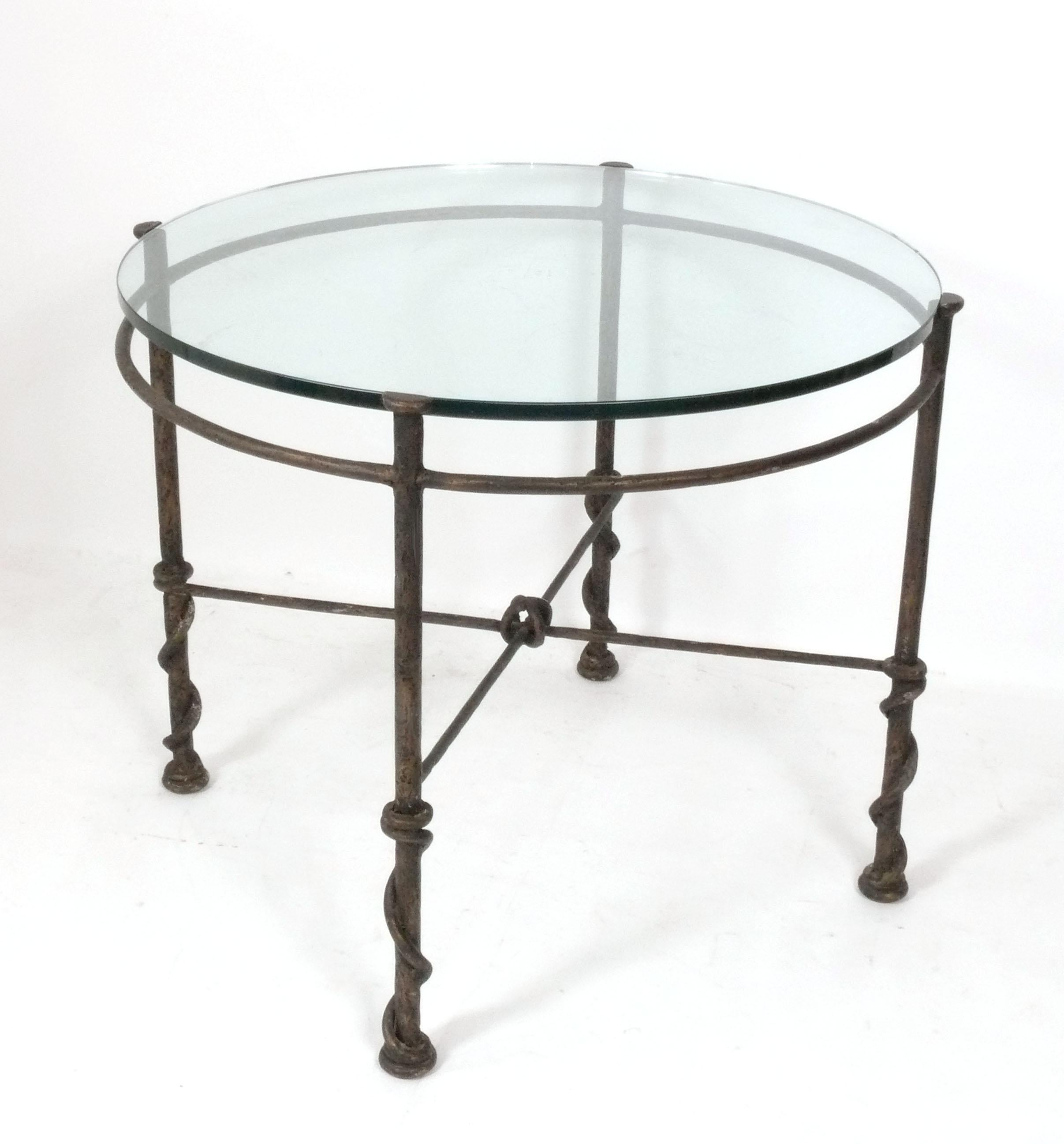 Sculptural Iron Table, in the manner of Diego Giacometti, France, circa 1970s. It is a versatile size and can be used as a center table, dining table, breakfast table, or game table. The glass top has a couple chips (see last photos) and some