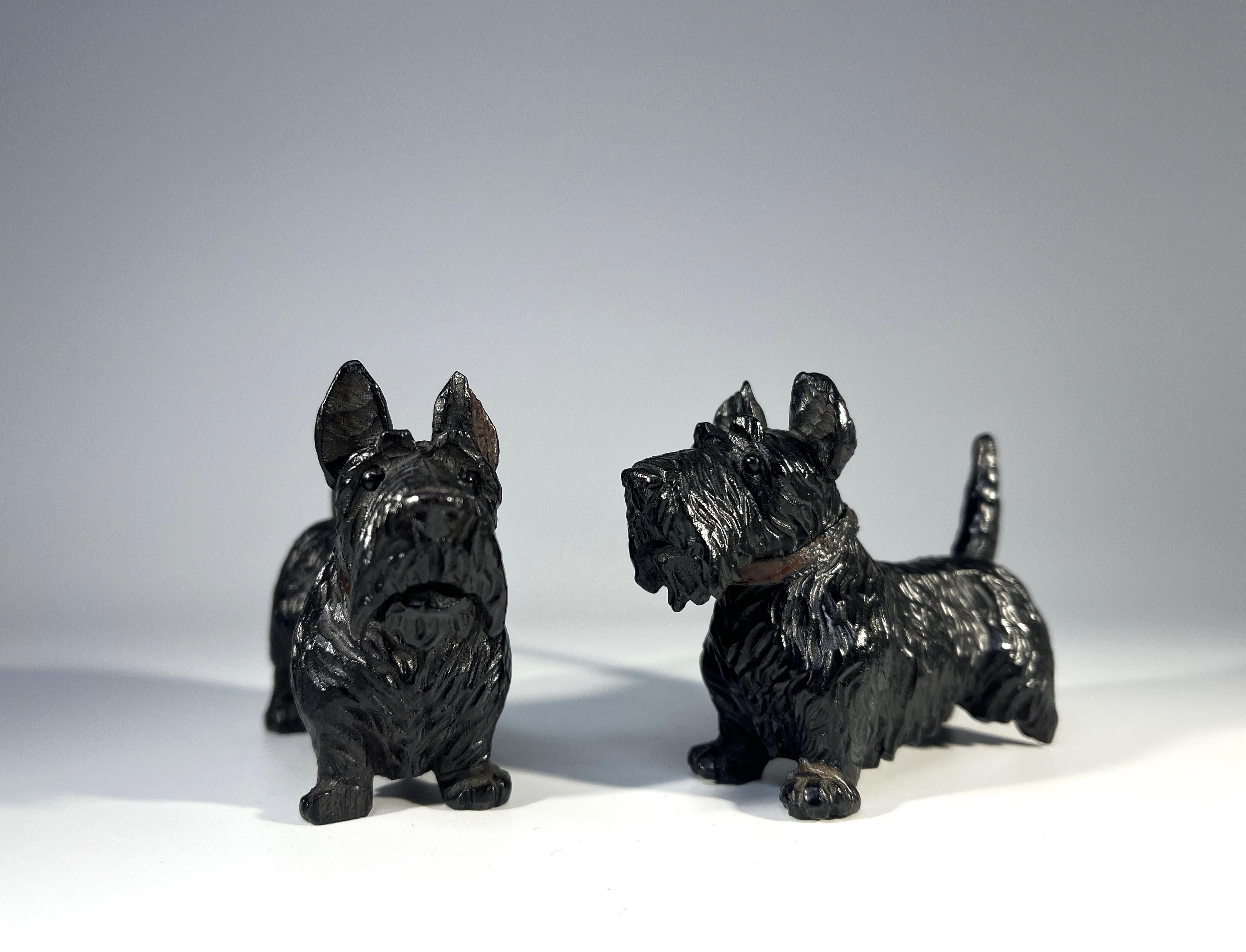 A brave and diehard pair of miniature Black Forest hand carved wooden Scottish Terrier dogs
Carved in typical dark wood and sporting leather collars, these Scotties were most likely created in the mid 20th century
Figure 1. Height 2.5 inch, Width 1