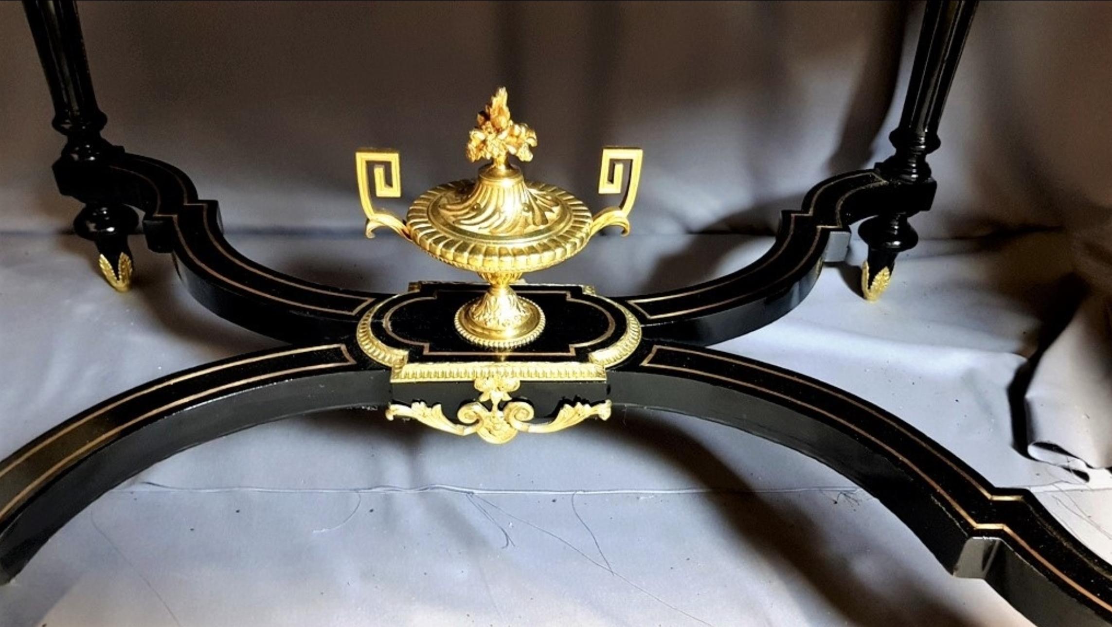 Stunning marquetry table stamped by the famous Charles Guillaume Diehl in Napoleon III in geometric Boulle brass marquetry, with very rich ornamentation of gilt bronzes. Falls, molds, hooves, large top on the spacer.
Diehl furniture is part of the