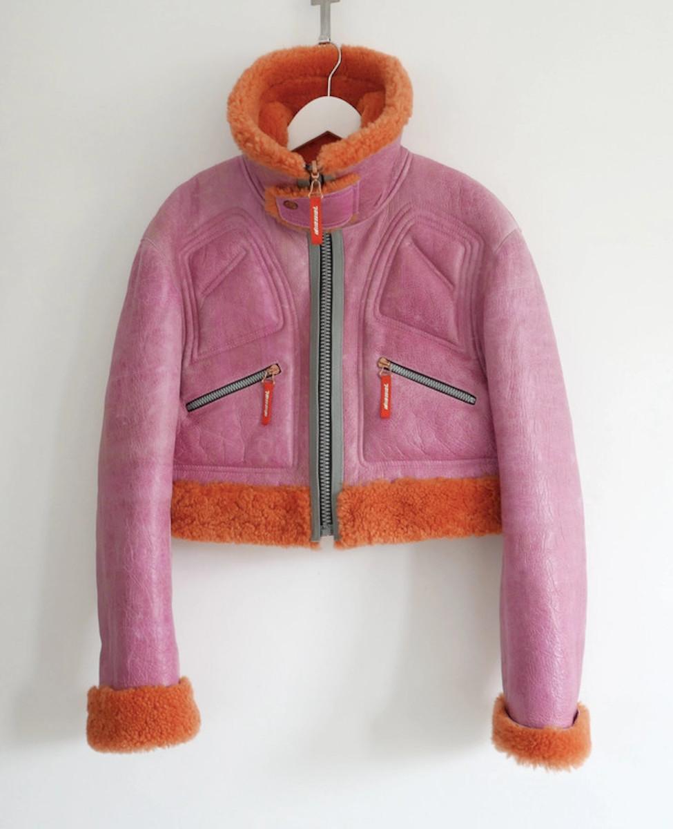 Stunning, statement Diesel leather and shearling cropped biker jacket. Bought for £1250 and worn a handful of times. Made from pink crackled semi patent leather which has a deliberate antiqued/sepia finish, it has bright orange shearling and grey