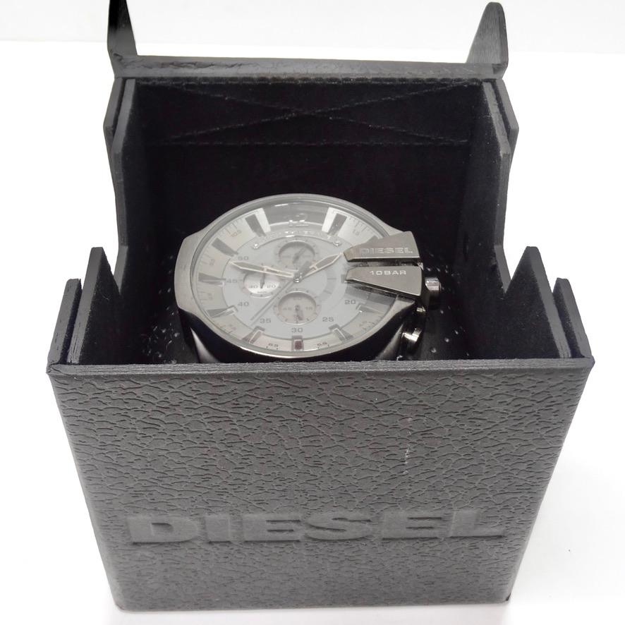 Get your hands on this incredible Diesel wrist watch! Large silver stone classic unisex watch features ion-plated stainless steel case and bracelet, a fold-over clasp closure with push-button release, three-hand analog display with quartz movement,