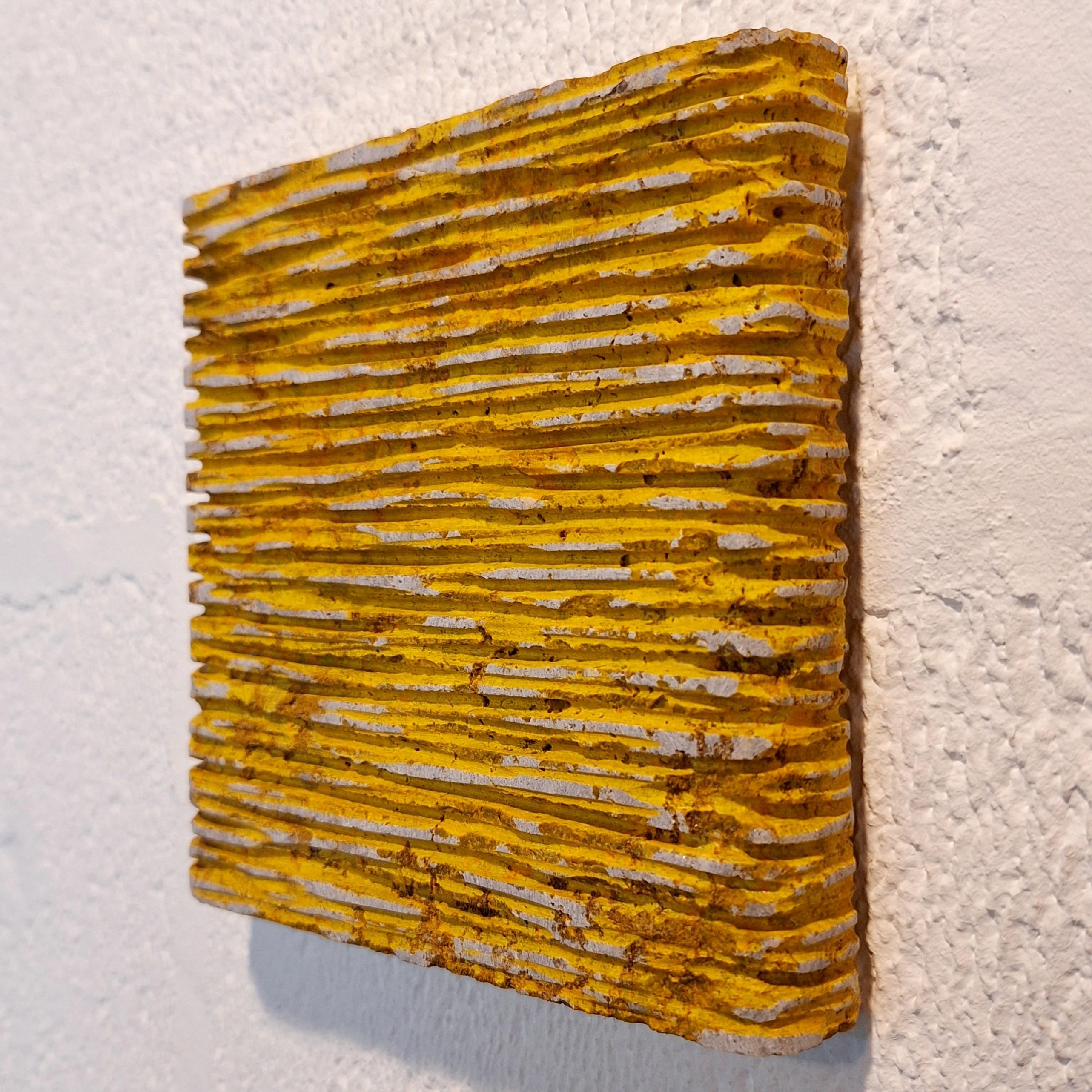 o.T. (YE15LH) is a unique small size contemporary modern wall sculpture painting relief by German artist Dieter Kränzlein. This sculpture relief is carved from a single block of limestone, treated with a thin layer of specially developed yellow ink