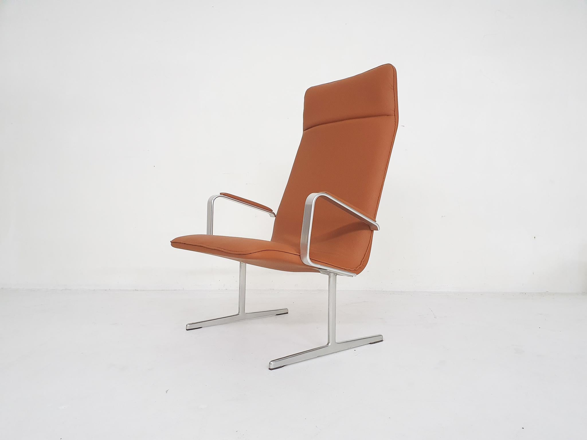 Very rare lounge chair designed by Dieter Rams for Vitsoe. We do not see this high back version a lot, let a lone with arm rests.

The chair has been reupholstered in cognac faux-leather.
The metal has some minimal traces of use.