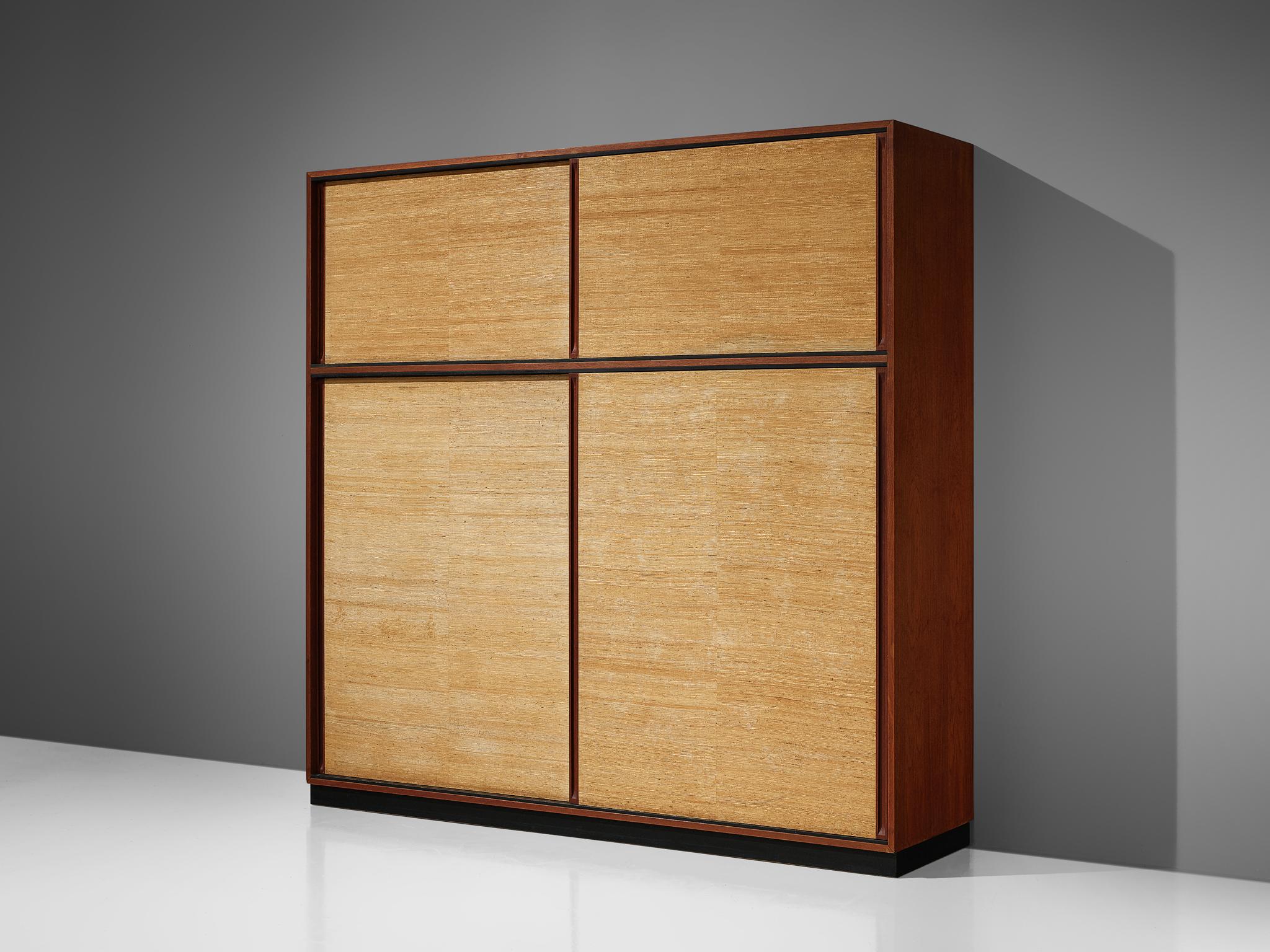 Dieter Waeckerlin, Behr Möbel, high board, teak, seagrass, Germany, 1950s

This rare and stunning large cabinet or wardrobe by Dieter Waeckerlin for Behr Möbel features a body made of teak with sliding doors covered in seagrass. While being