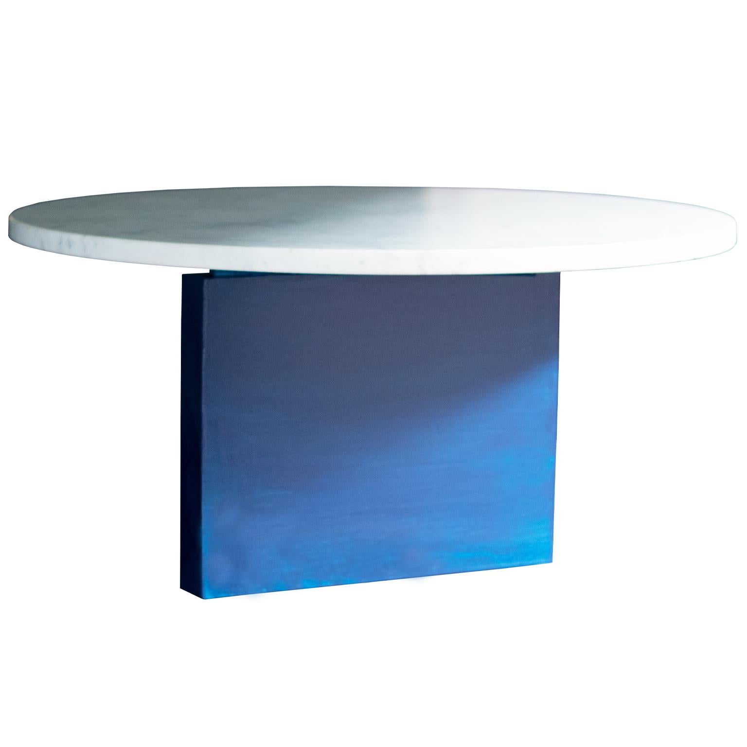 This table features a honed Carrara marble top with a sculptural, asymmetrical solid maple base with a hand lacquered finish. 
A statement piece on its own, this table offers a unique Silhouette dependant on the observers perspective.