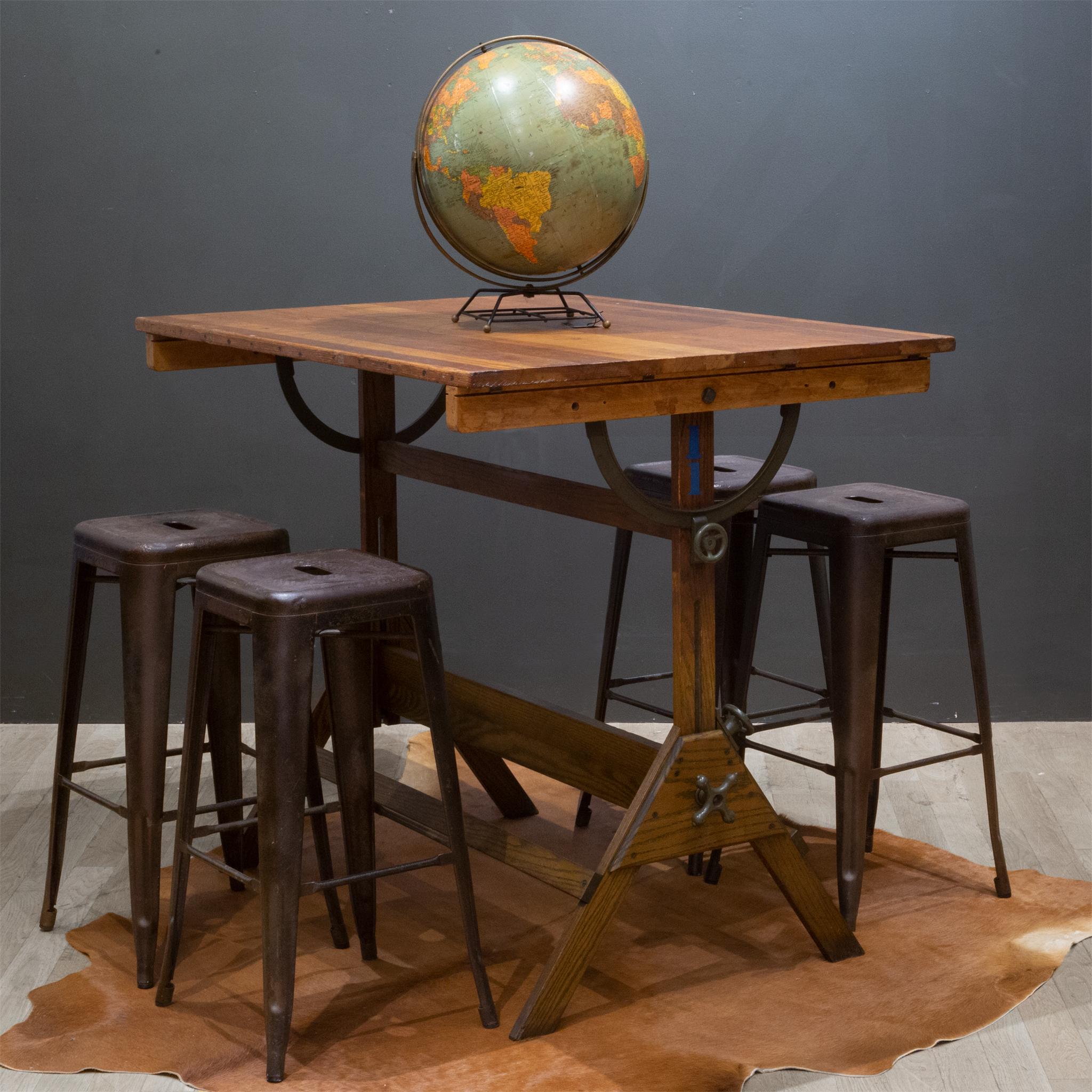 About

A fully adjustable industrial wooden drafting table with Army green steel and cast iron knobs and brackets. The table can be used as a tall dining table, standing desk or drafting table. The top swivels at any angle and from either side.