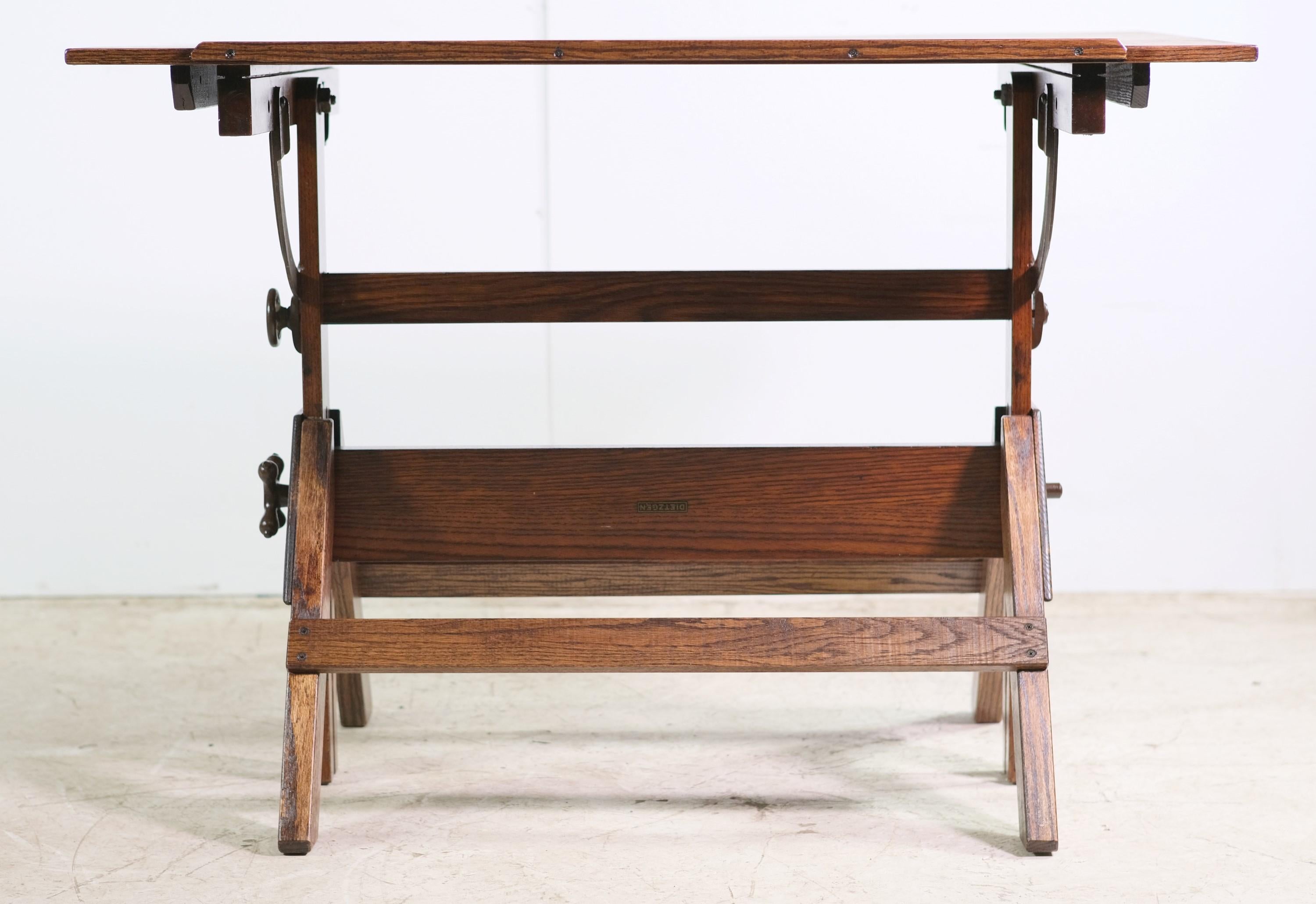 Vintage Dietzgen solid oak drafting table with steel hardware for adjusting the tabletop tilt. It also features steel knobs for adjusting the height. Made by Dietzgen. This can be seen at our 400 Gilligan St location in Scranton, PA.