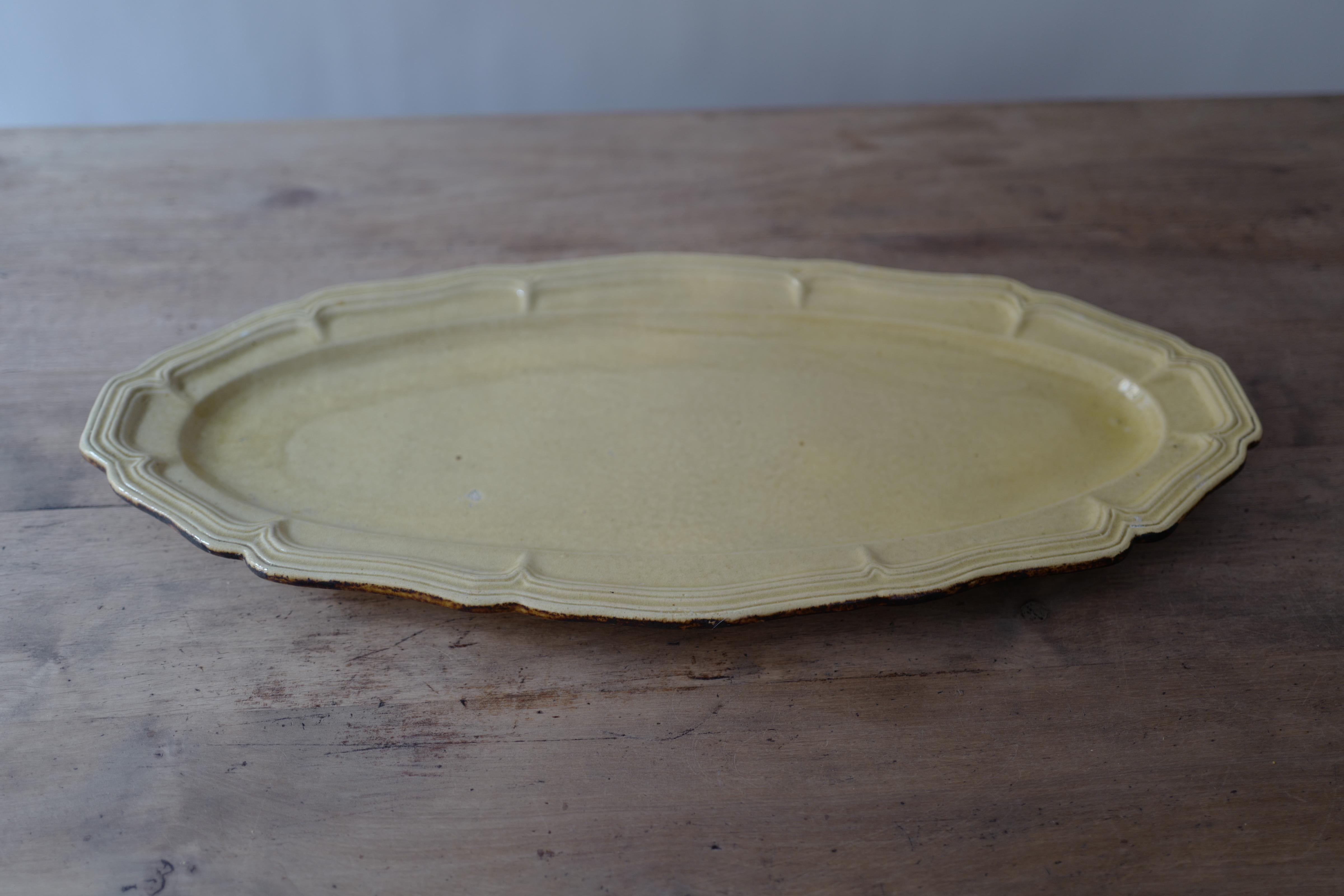 Dieulefit Poteries de Haute Provence Yellow glazed earthenware scalloped edge trimmed in brown serving platter from village of Dieulefit circa 1950's. 