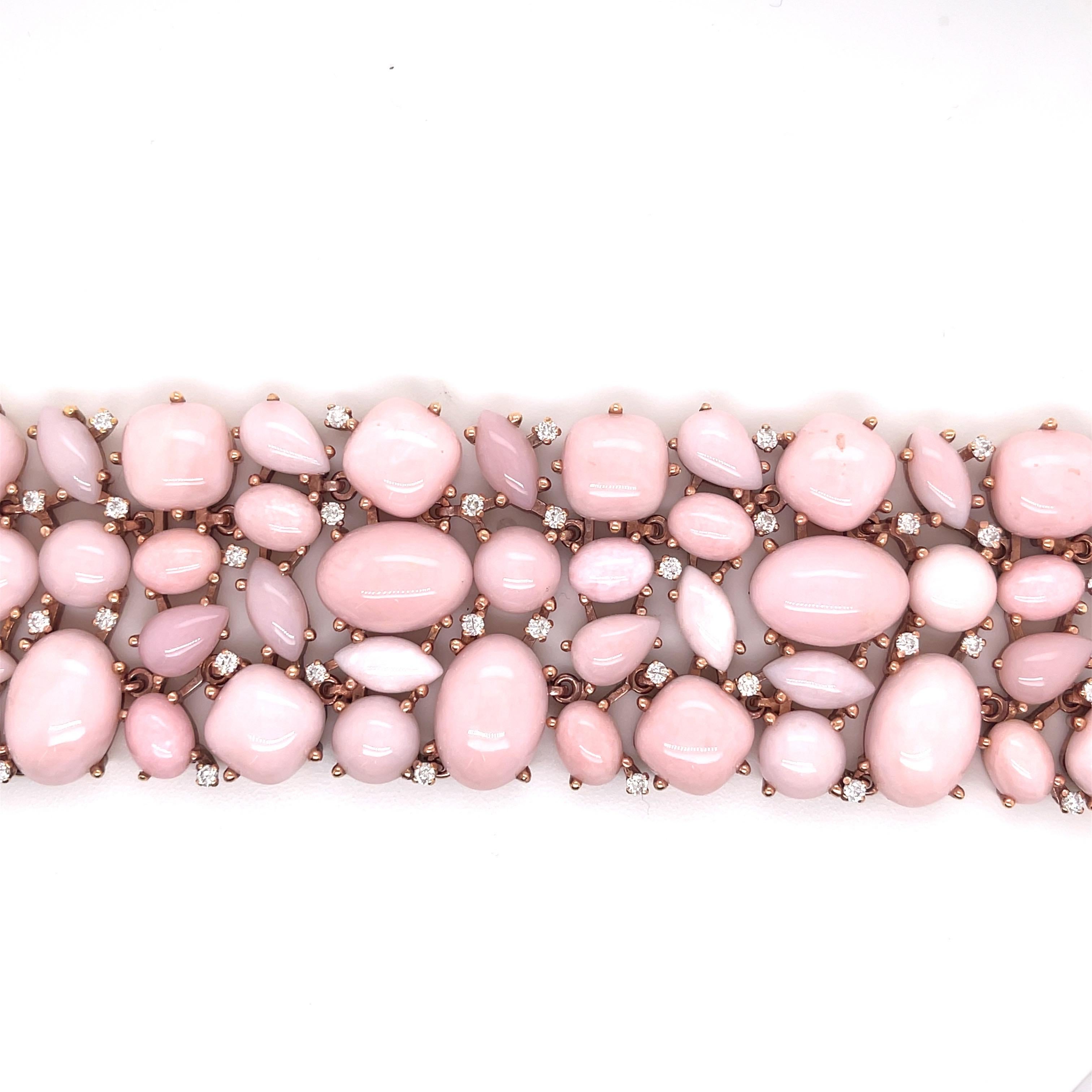 One of a kind, hand made Opal and diamond bracelet
Approximately 1 Carat of Diamonds Bracelet total weight 94.8 g.
Approximately 500 Carats of Light Pink Opals
18K rose gold