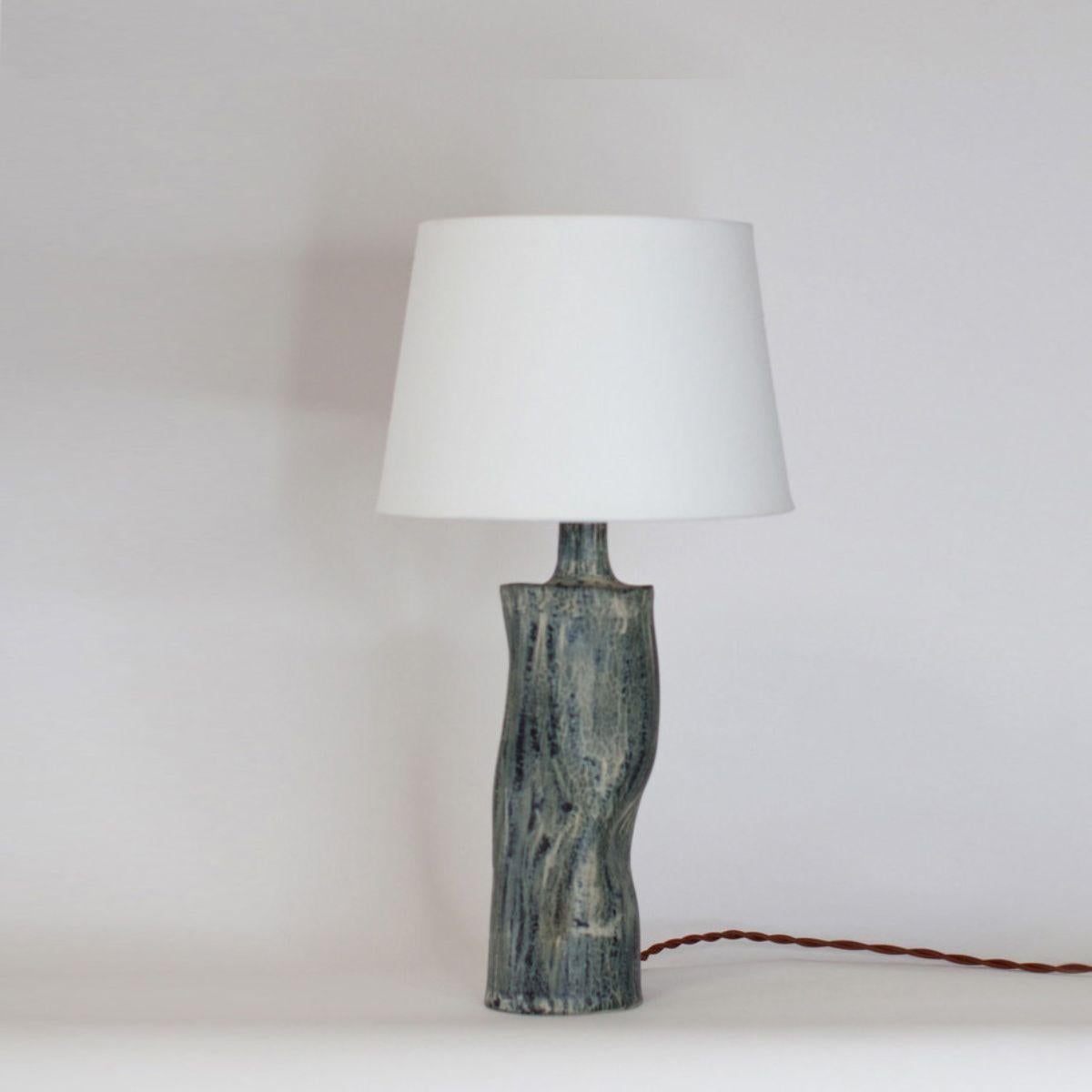 'Difforme' tiger glaze ceramic table lamp with parchment shade by Design Frères.

Wired with high-end twist cord and 3-way switch (on, half intensity, off). A 40w filament bulb is included in your order. The European style parchment shade (no harp