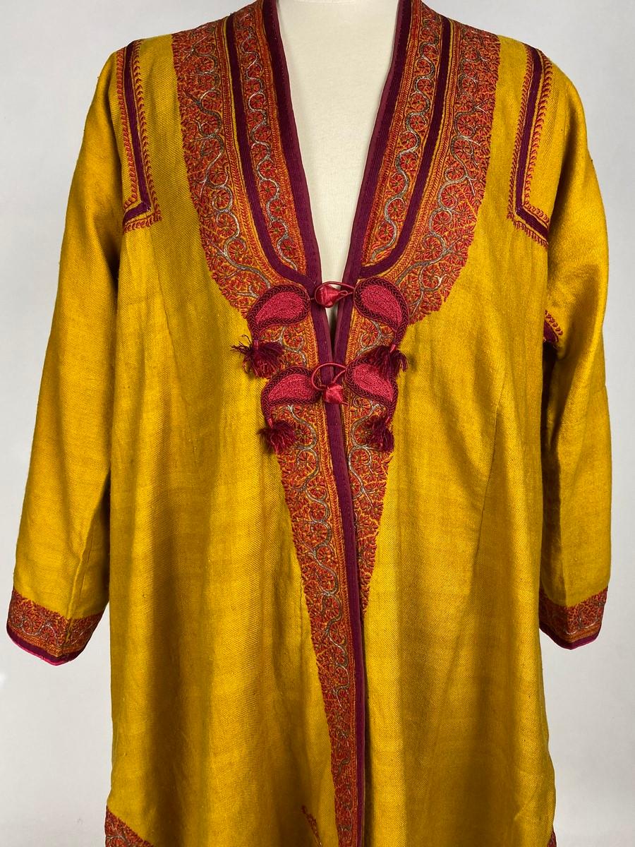 Second half of the 19th century
India Punjab

Male coat of an Indian dignitary called Choga from the Punjab region (Amristar) end of the 19th century. Very fine Curry yellow pashmina densely embroidered with red silk threads and silver thread.