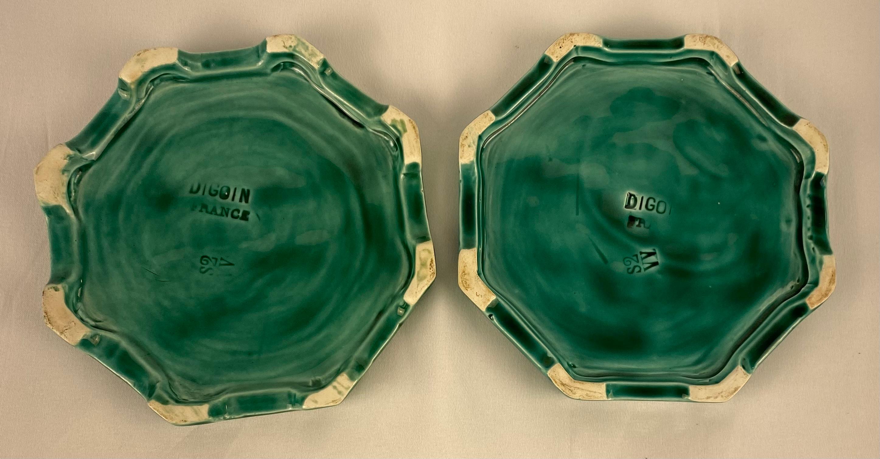 A good quality set of French ceramics by Digoin Sarreguemines, France, circa 1950s. 

The set consists of a large platter or bowl and two generously sized wine bottle coasters to protect your table linens. The eye catching green majolica glaze