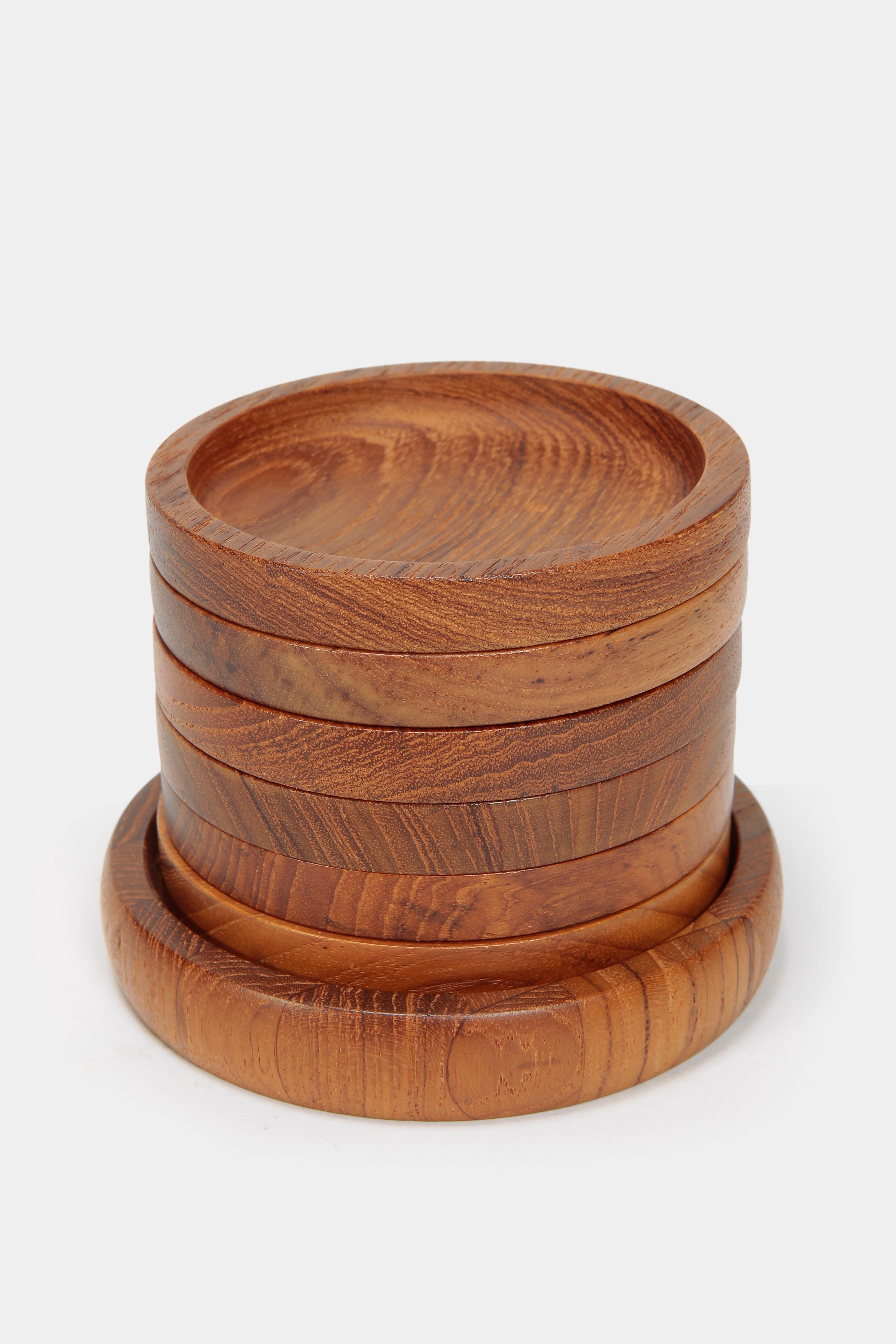 Set of solid teak coasters from the company Digsmed, made in the seventies in Denmark. Very beautiful object showcasing all the facets of teakwood. Timeless design.