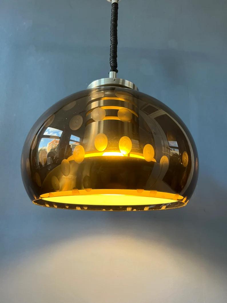 Space age mushroom pendant lamp by Dijkstra. The mushroom shade is made out of thick acrylic glass and produces a disco-like effect The inner shade is made from aluminium. The lamp requires one E27 (E26 in the US) lightbulb and is hardwired for 110v