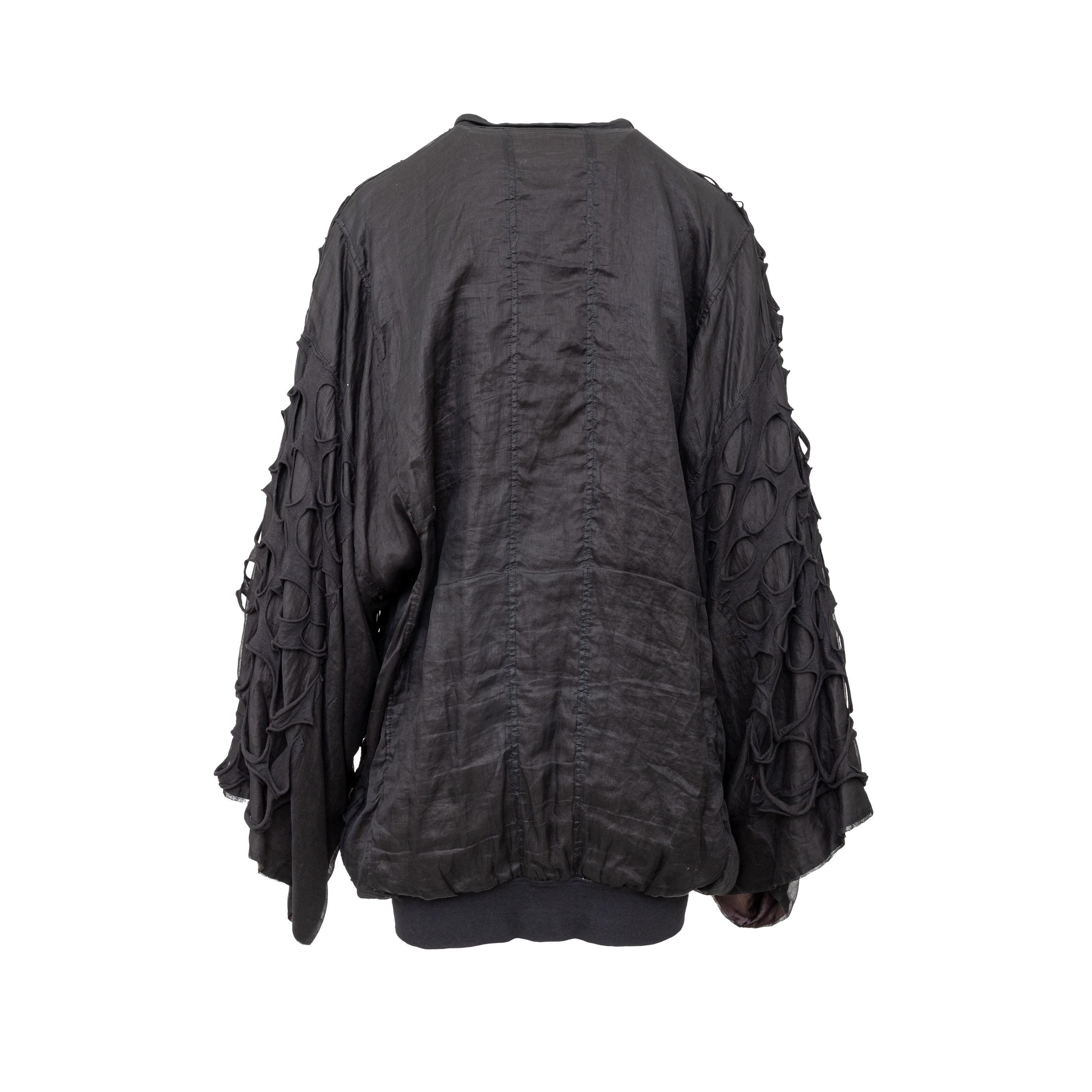 This Diliborio bomber jacket is crafted from a luxurious black silk fabric and features an oversized design with wide sleeves and a central zip fastening. The cut-out details on the overlay adds a distinctive edge to the look.
 
 Total