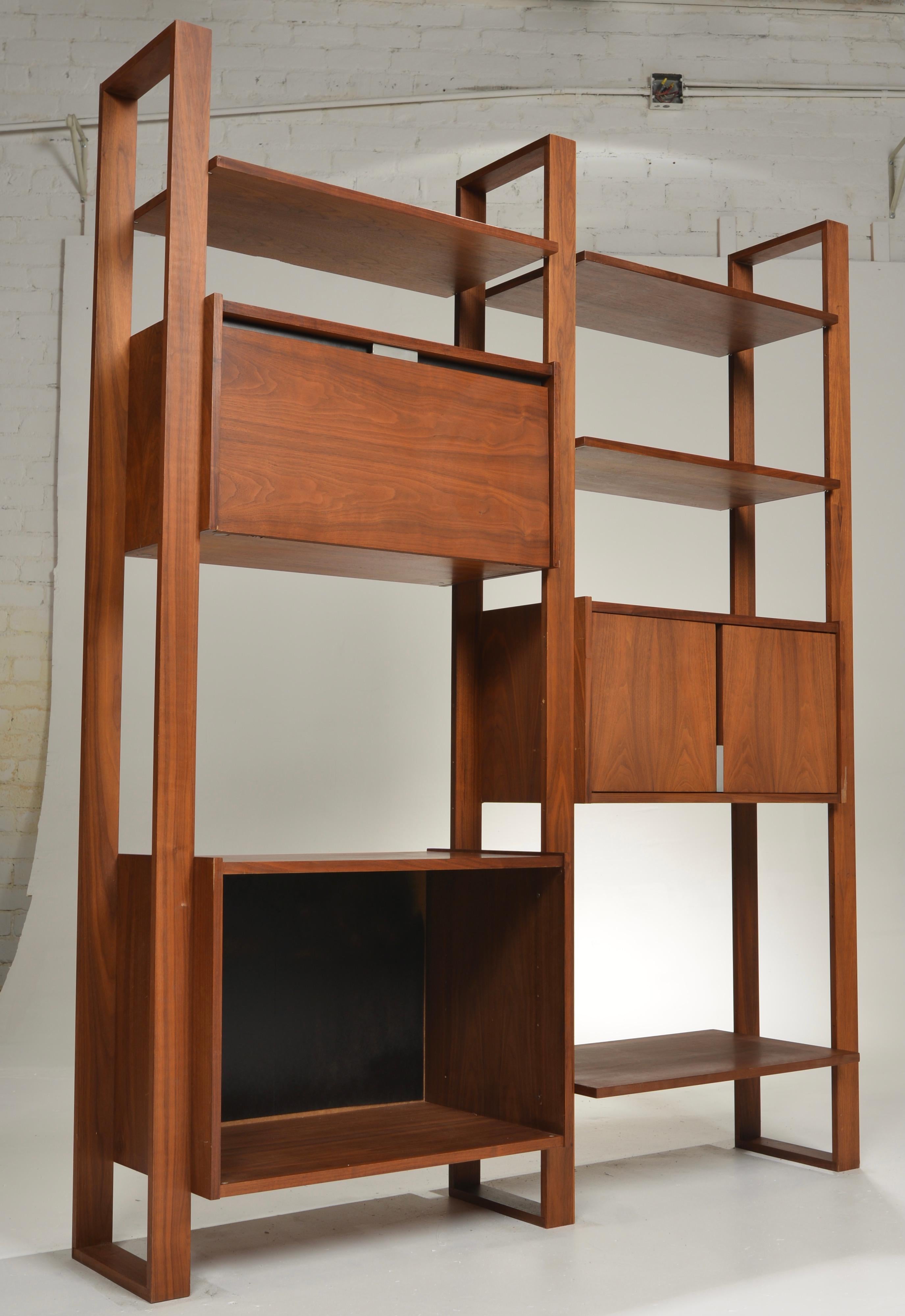 This is a beautifully crafted wall unit by Dillingham. The cabinets and shelves are modular and can be arranged as desired.